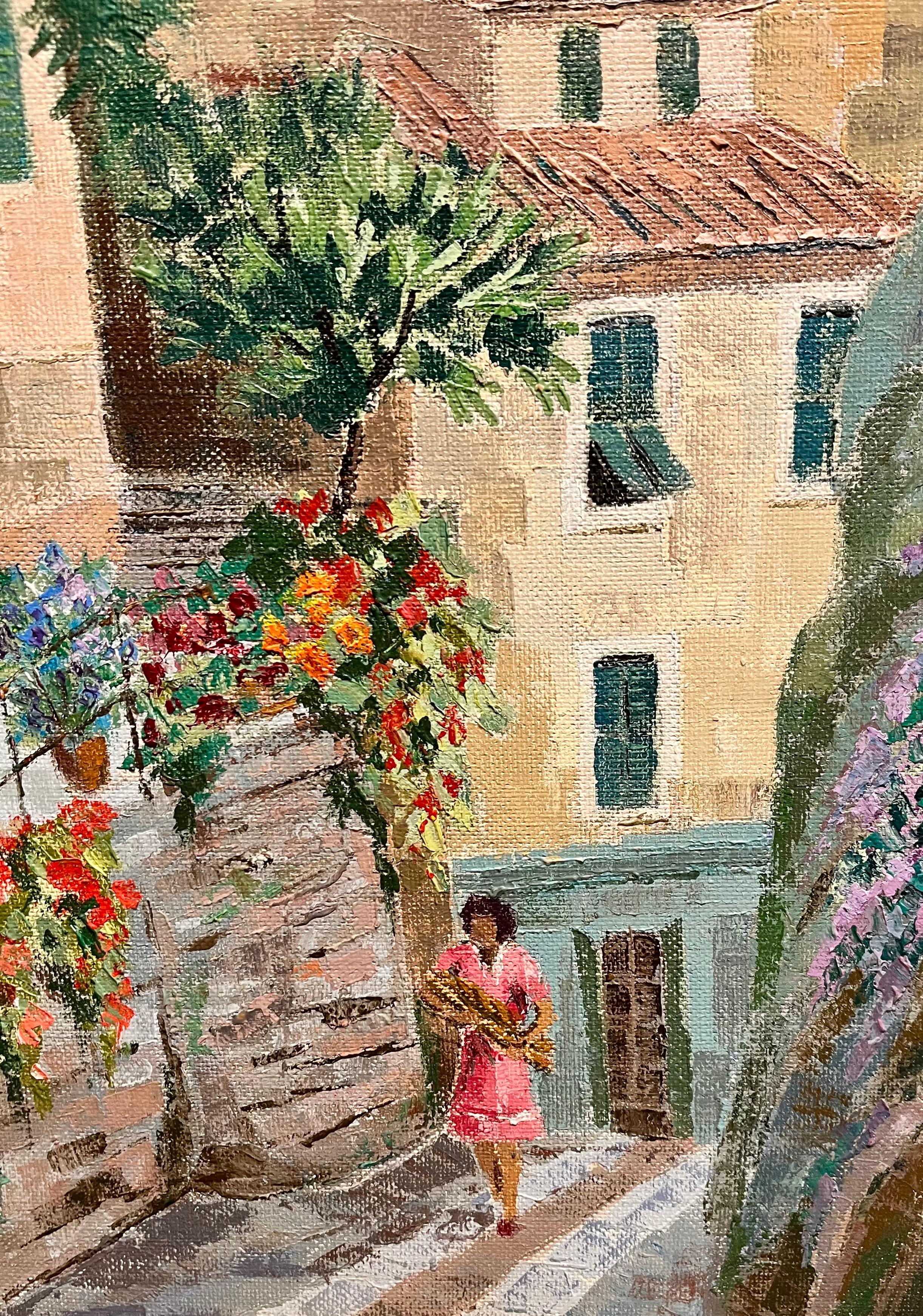 Joan Berthomieu’s Ruelle Fleurie is a vibrant and charming depiction of a flower-lined street in a sunlit European village. Signed in the lower left and again on the back with its title, this work exemplifies Berthomieu’s talent for capturing the