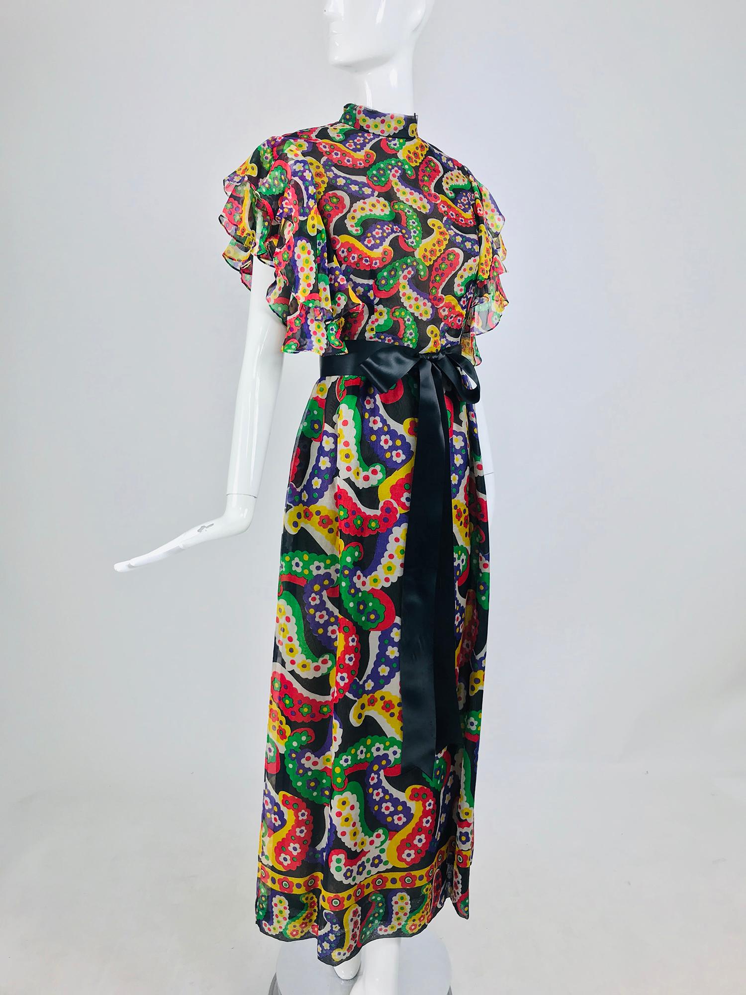 Joan Leslie for Kasper Paisley silk organza 30s inspired maxi dress from the 1970s. This summery dress is done in a bright candy colour over size paisley print. The dress has a high banded collar, with a fitted bodice. It's all about the sleeves