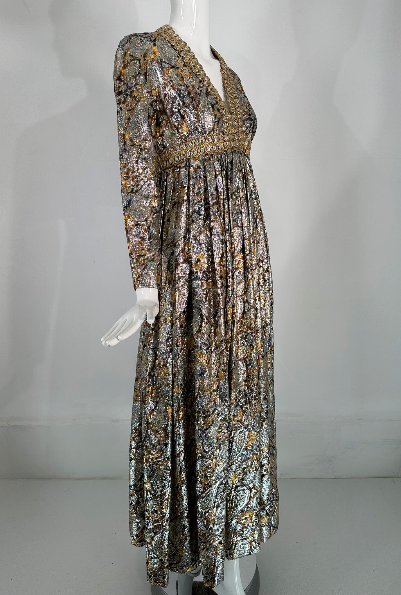 Kasper for Joan Leslie
1968 Documented Paisley Silk & Lurex Gown. Silver metallic brocade, with gold passementerie neckline, empire maxi dress from 1968. This gorgeous dress was created by Herbert Kasper who started designing for Joan Leslie in 1965