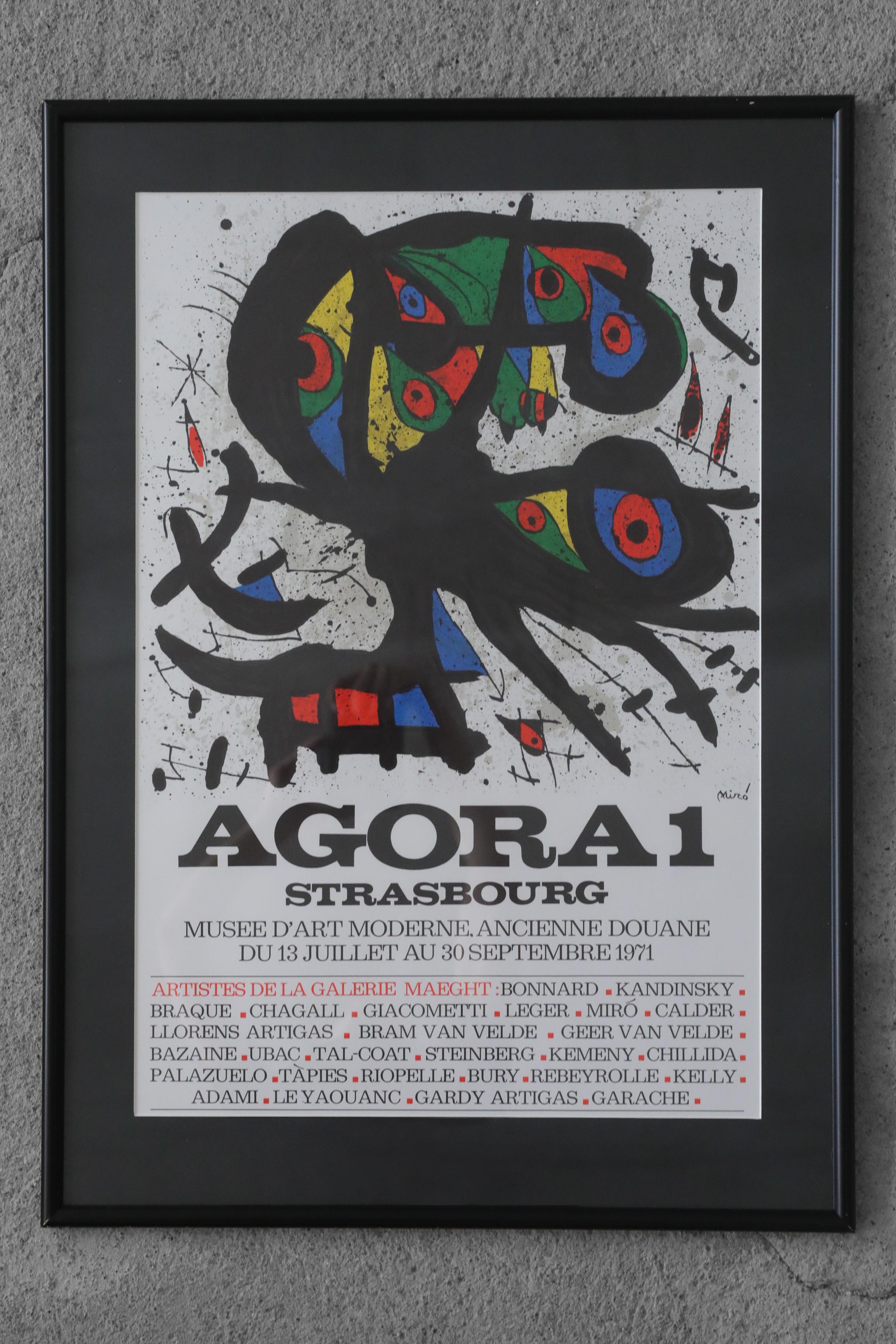 Joan Miró, Agora I, 1971
Lithographie couleur
Œuvre signée par l'artiste
Dimensions de travail 71/51
Œuvre encadrée

Affiche lithographique pour une exposition d'artistes représentés par la Galeria Aght au Musée d'Art Moderne de Strasbourg en 1971.