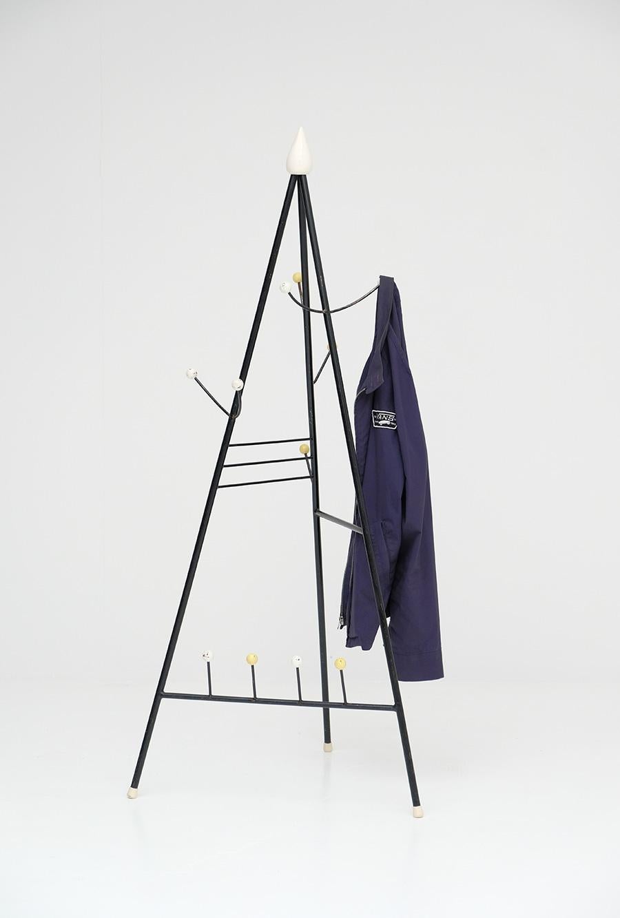 A rare and hard to find tipi shaped coat / hat and shoe stand. I only did find these in Belgium and this only for the 3th time in 20 years. Because of its playful shapes and color, it always reminds me on the work of painter Joan Miro. The coat