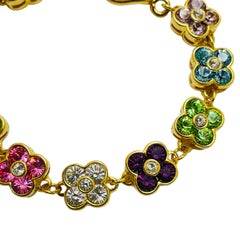 Bracciale firmato JOAN RIVERS con fiori di cristallo placcati in oro vintage