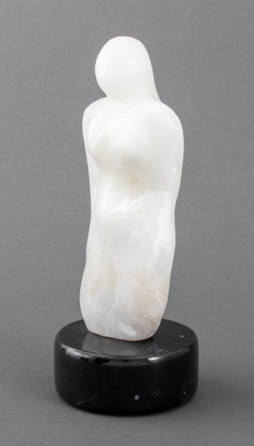 Joan Hyde Shapiro (American, XX-XXI) White Alabaster Stone Sculpture depicting a stylized female figure, signed to reverse, mounted on a black marble base. 10.25