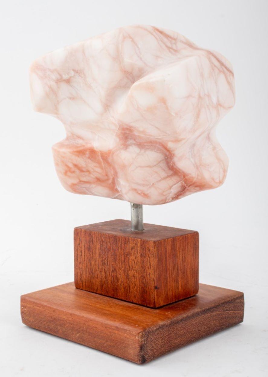Joan Hyde Shapiro (American, XX-XXI) Modern Abstract Pink Alabaster Stone Sculpture, carved into an organic freeform shape, signed to reverse, mounted on a tiered wood base. 8.75