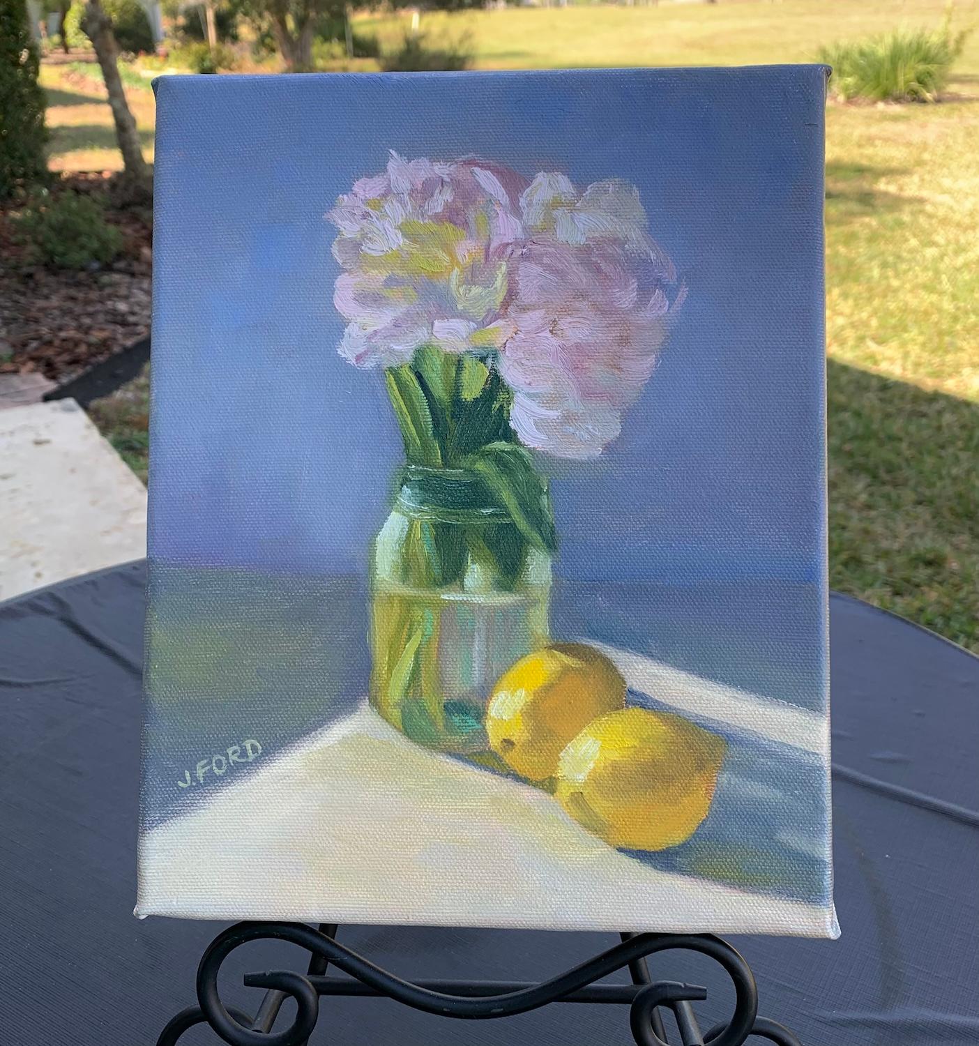 <p>Artist Comments<br>Two lemons and a vase of dainty flowers glow under the gentle radiance of the sun, exuding timeless charm. Muted pinks and blues contrast with the vivid yellows. The soft strokes imbue the still life with a sense of stillness