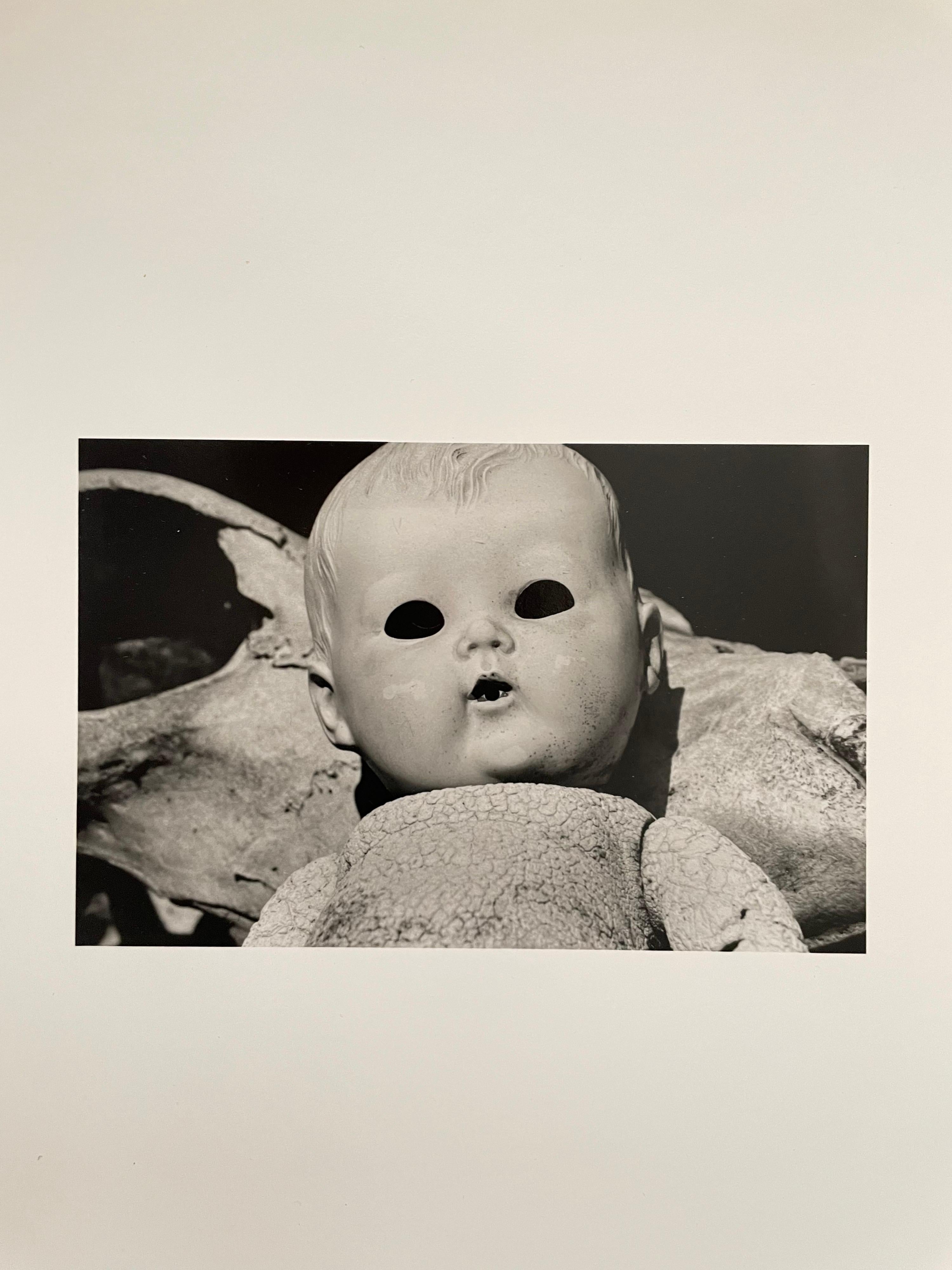 Vintage Silver Gelatin Photograph Surrealist Doll Art Photo, Jazz Photographer  - Beige Still-Life Photograph by JoAnn Krivin