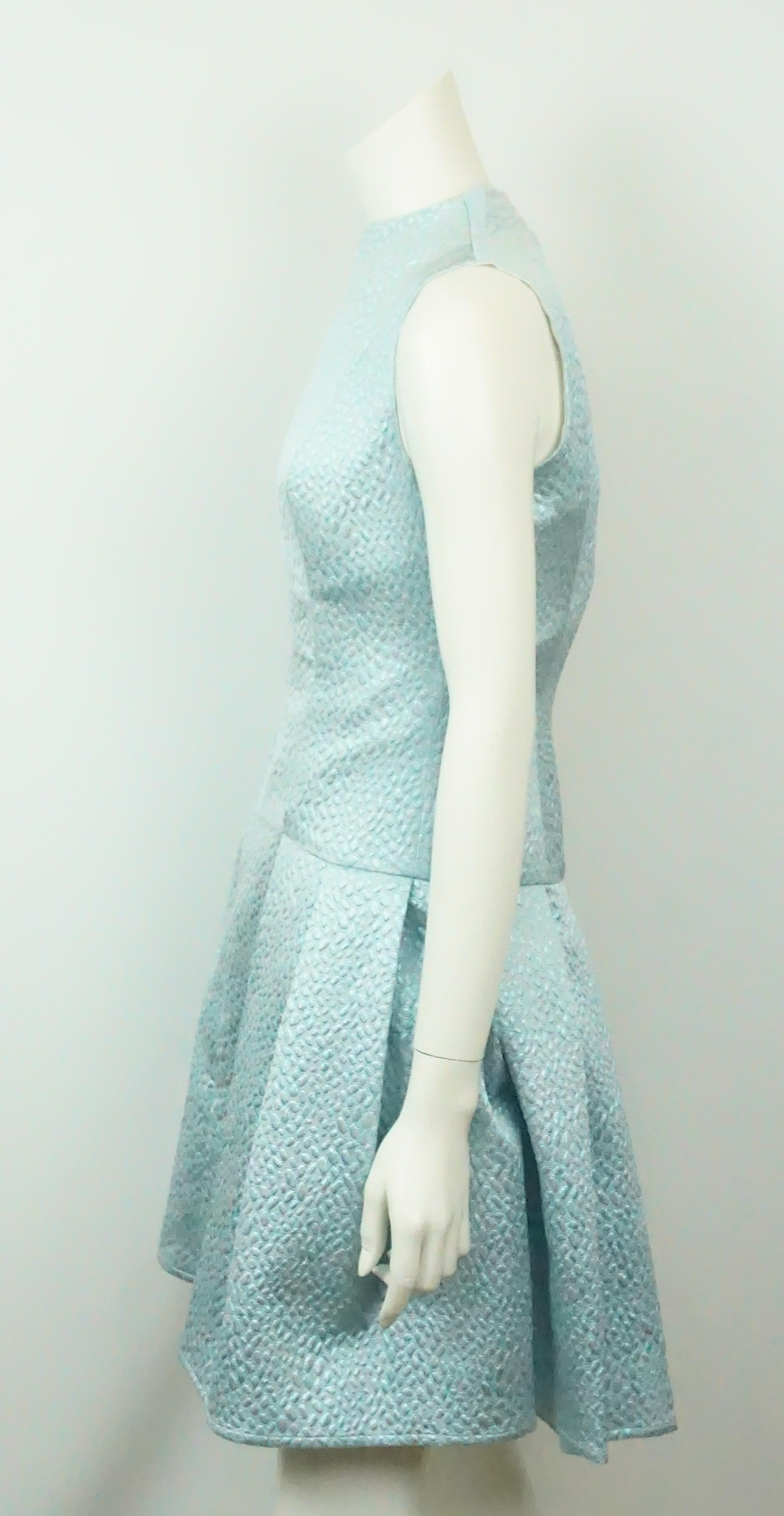 Joanna Mastroianni Mint Brocade Dress N/S-2. This fabulous sleeveless dress is in excellent condition. It is a light blue minty color. There is no sign of wear. The dress has a silver metallic detailed pattern. It has a front zip w/ a high neckline