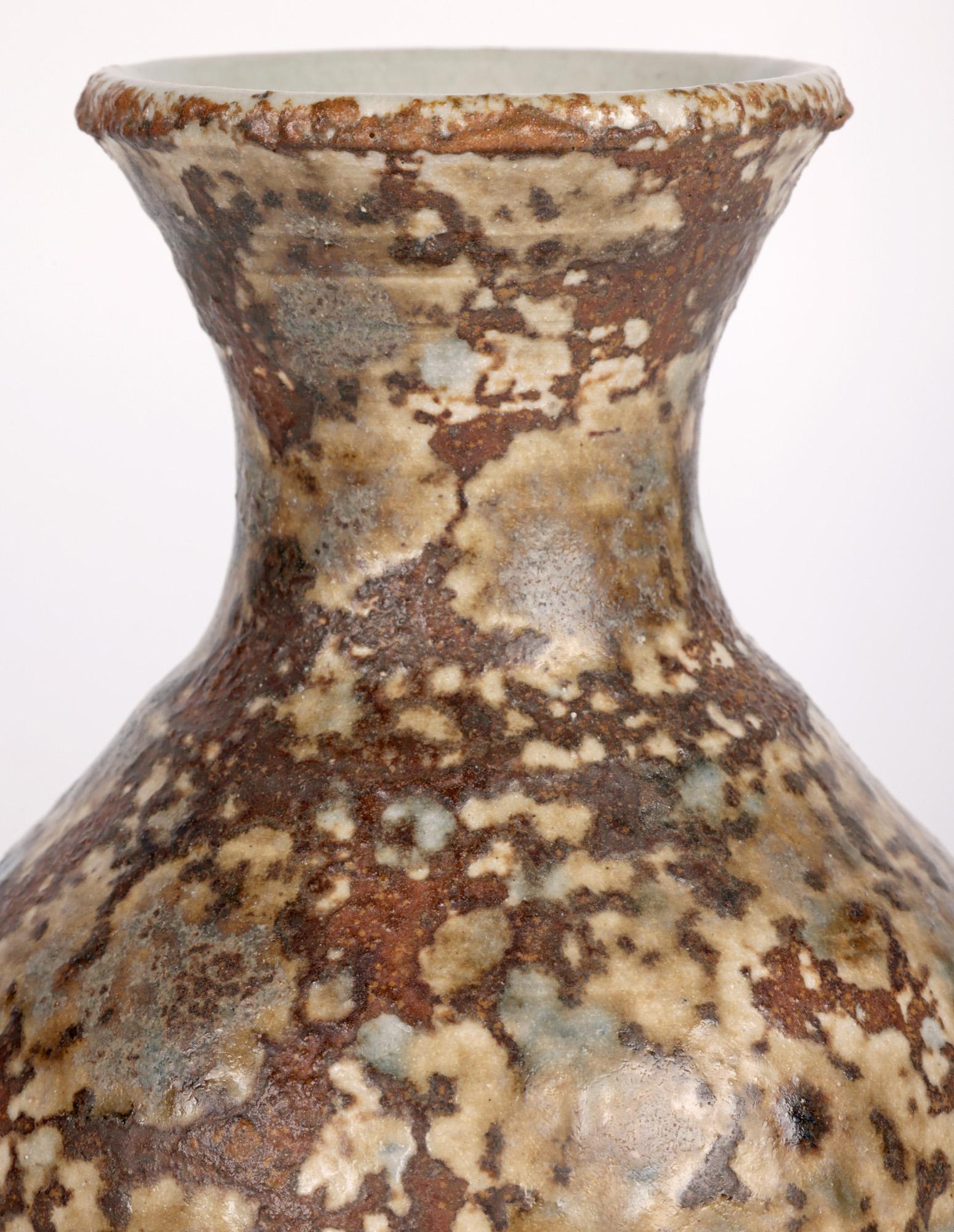 An unusual and individual Leach Pottery, St Ives hand thrown studio pottery vase decorated in mottled glazes by renowned Cornish based potter Joanna Wason (German, b.1952) and dating from around 2000. 

Joanna graduated from Exeter College of Art