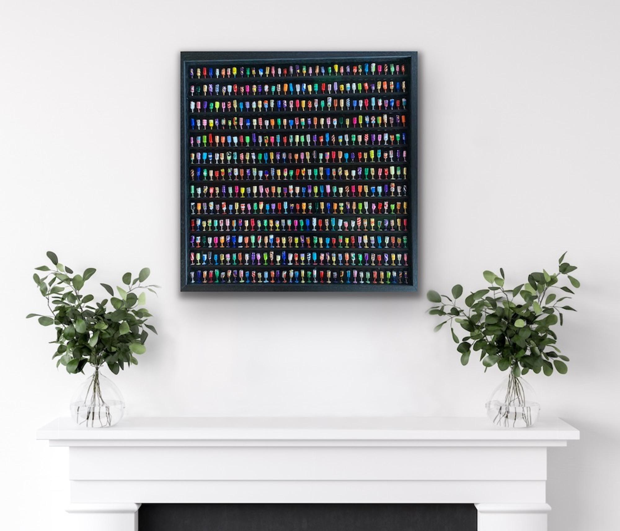 Goblets IX is a signed original wall sculpture made from sweet wrappers by Joanne Tinker of a selection of colourful wine goblets on a black shelved frame.

Additional information:
Goblets XXIV by Joanne Tinker [2022]
Sweet Wrappers
Image size: H:64