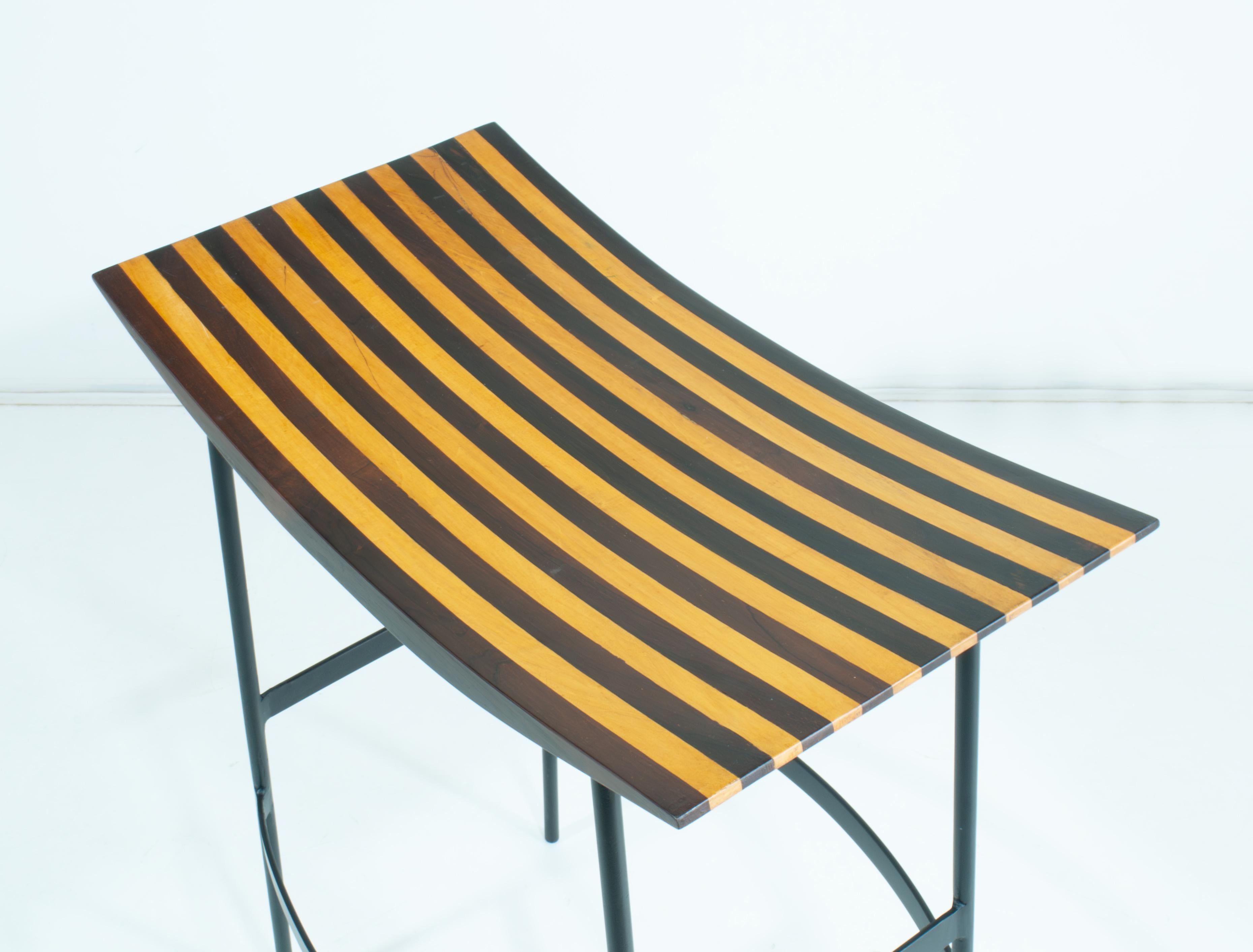Very rare set of 2 original Joaquim Tenreiro Brazil Modern mid-century bar/counter stools, manufactured by Tenreiro Móveis e Decorações, Brazil 1950s, made of beautifully inlaid striped Amendoim and Imbuia woods, on black lacquered iron frames with