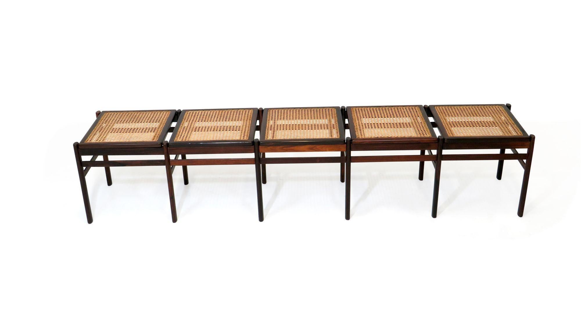 Bench crafted of dark figured solid Brazilian rosewood and handwoven cane in manner of Joaquim Tenreiro.
Bench is in excellent condition with minor signs of age and use.
Measurements
W 84.25'' x D 16.75'' x H 17''