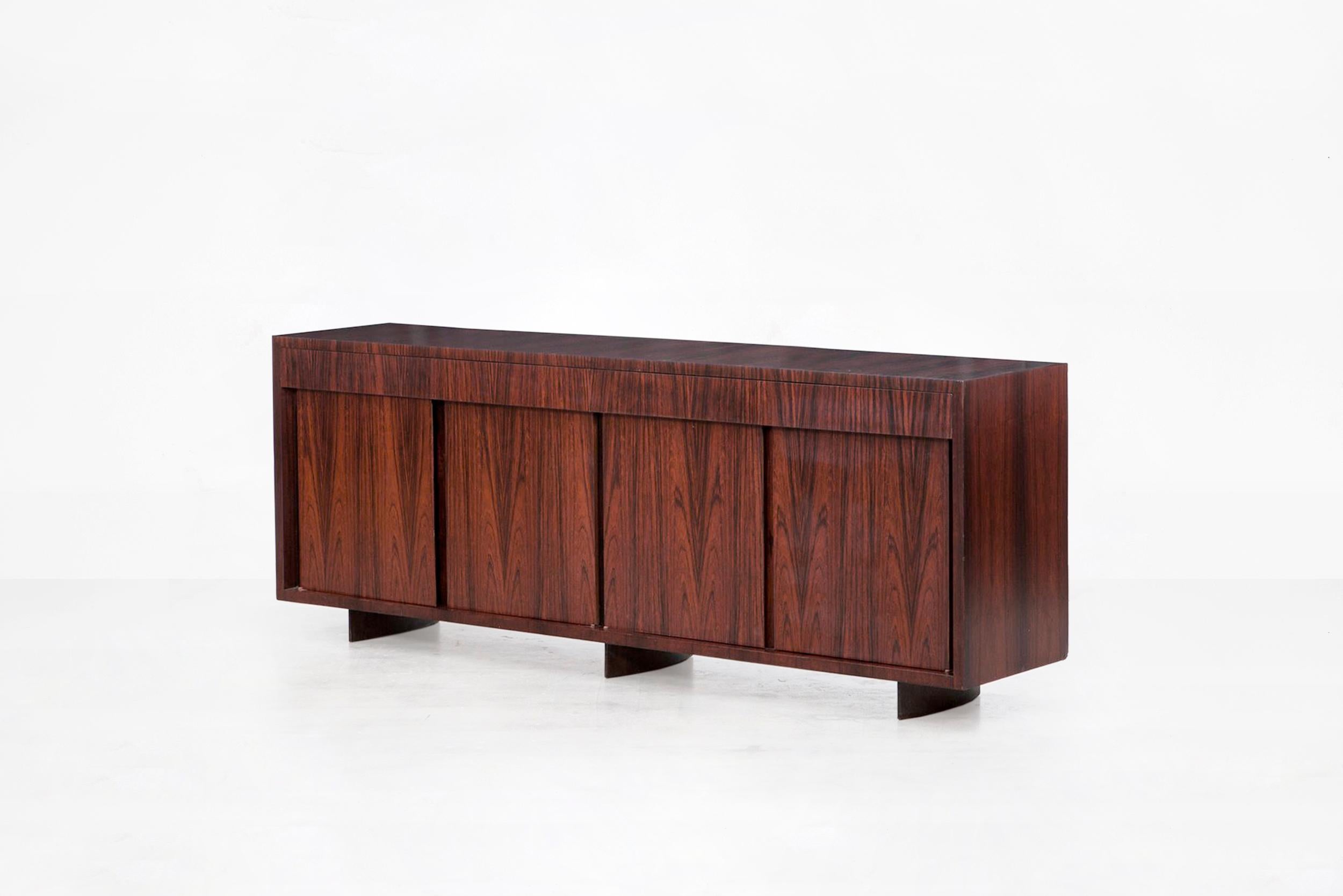 Joaquim Tenreiro
Buffet
Manufactured by Tenreiro Movèis & Decorações
Brasil, 1950
Jacaranda (rosewood) wood
From the archives of Side Gallery, Barcelona 

Measurements:
200 cm x 45 cm x 75.5 cm
78.7 in x 17.71 in x 13.18 H in

Biography
Joaquim