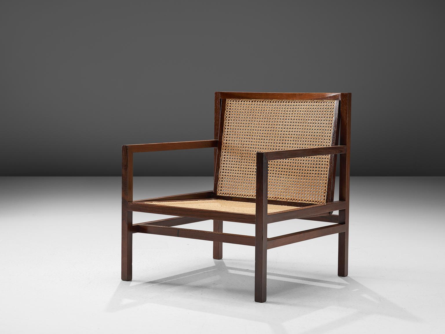 Joaquim Tenreiro, armchair, rosewood and cane, Brazil, 1958

This lounge chair is designed by the Brazilian master designer Joaquim Tenreiro. This chair designed around 1958 has typical traits of the design by Tenreiro. First of all the use of