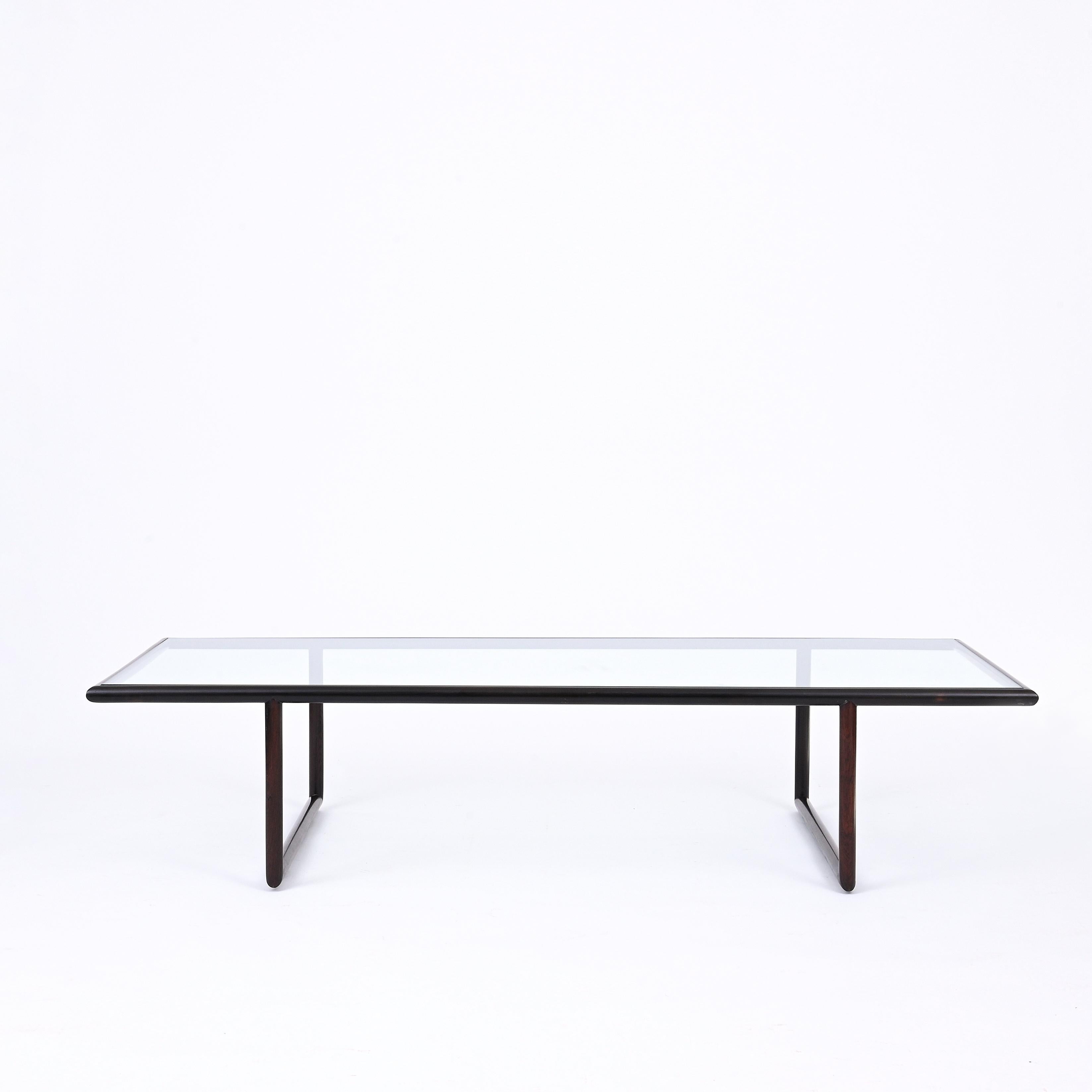 Joaquim Tenreiro's coffee table stands as a rare and unique piece within the realm of mid-20th century Brazilian furniture design. Crafted with meticulous attention to detail and imbued with a distinct artistic vision, this table showcases
