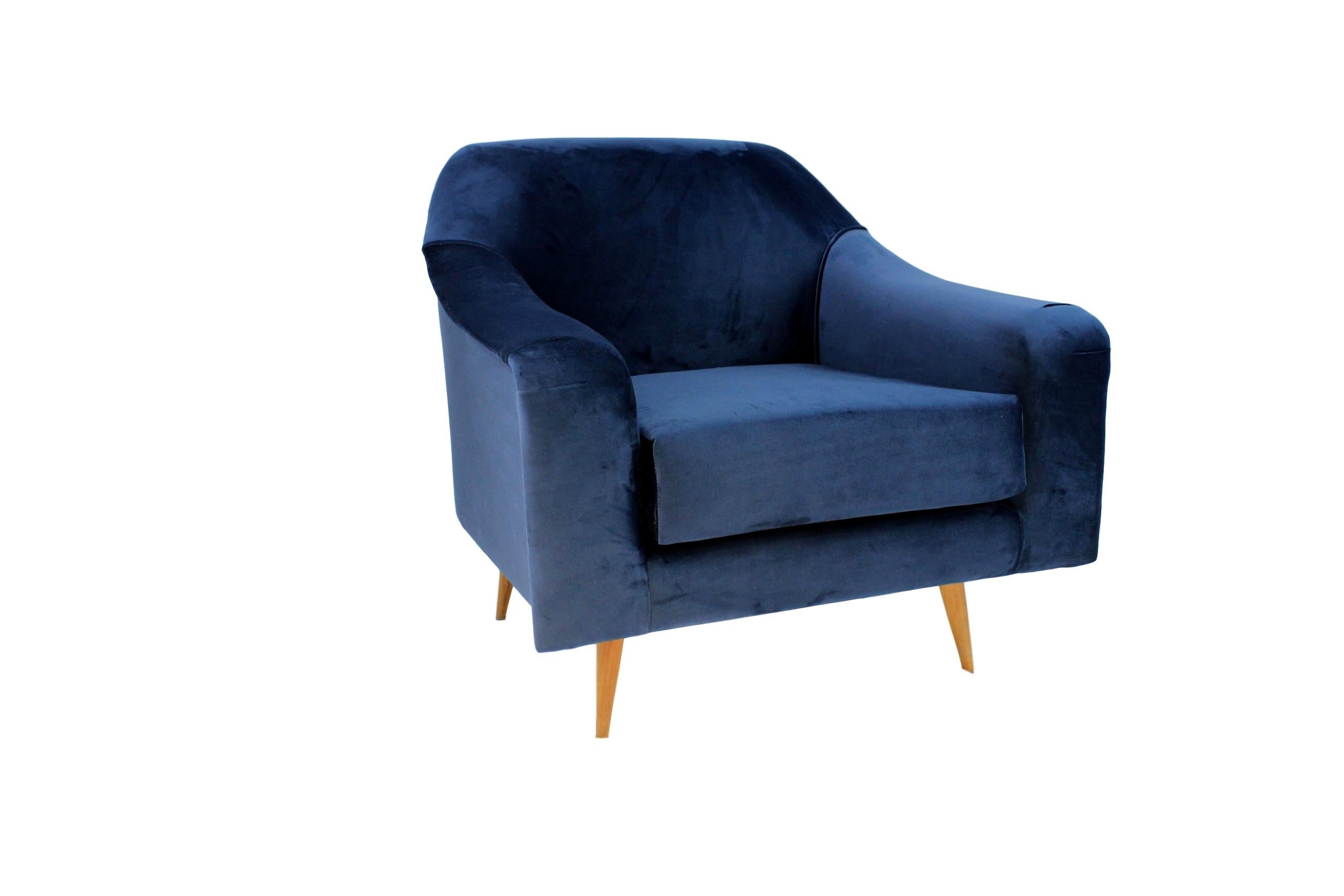 This iconic large armchair attributed to Joaquim Tenreiro is a must in your home, recently handcrafted upholstered in blue velvet presents a very nice touch and display well in any room. 

It's very comfy as well, ready to use, these chairs have