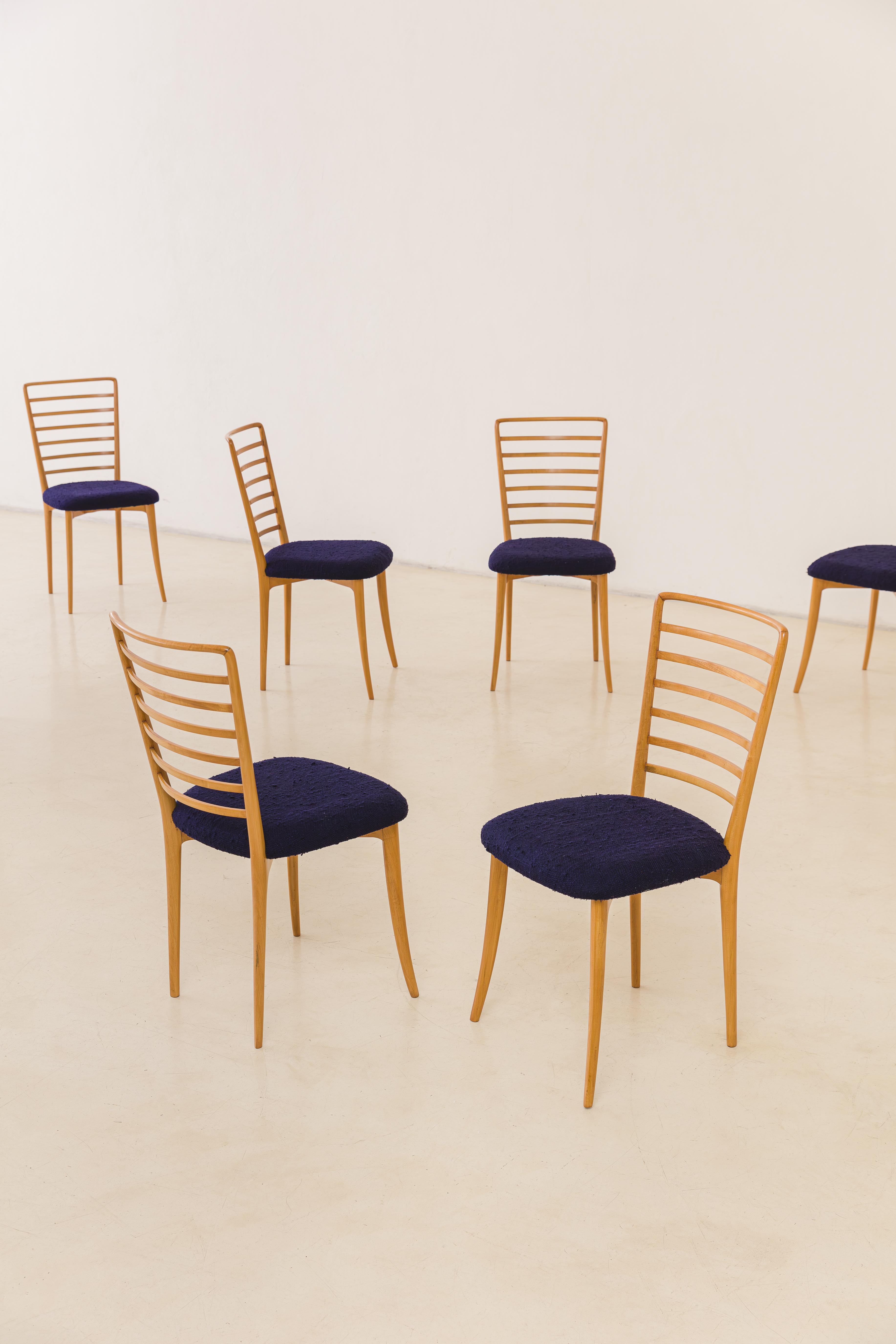 Available in eight units, this set of dining chairs was designed by Joaquim Tenreiro (1906-1992) in the 1950s. Much like Tenreiro's other creations, this sense of lightness transcends the weight and extends to surround grace and spatial