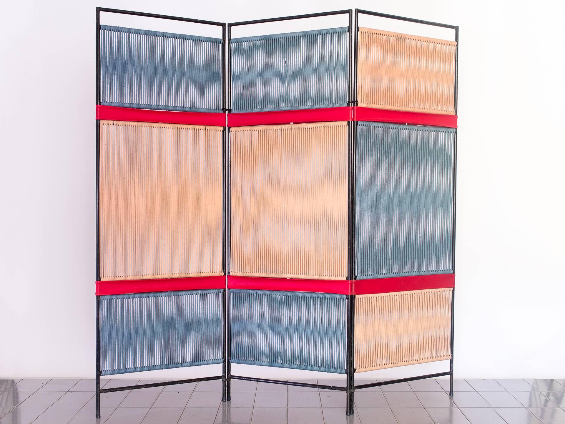 This folding screen / room divider is a unique piece designed by Tenreiro in the late 1950s. The proportions between panels and color disposition are typical of Tenreiro's geometrical pattern works, observed in several different custom