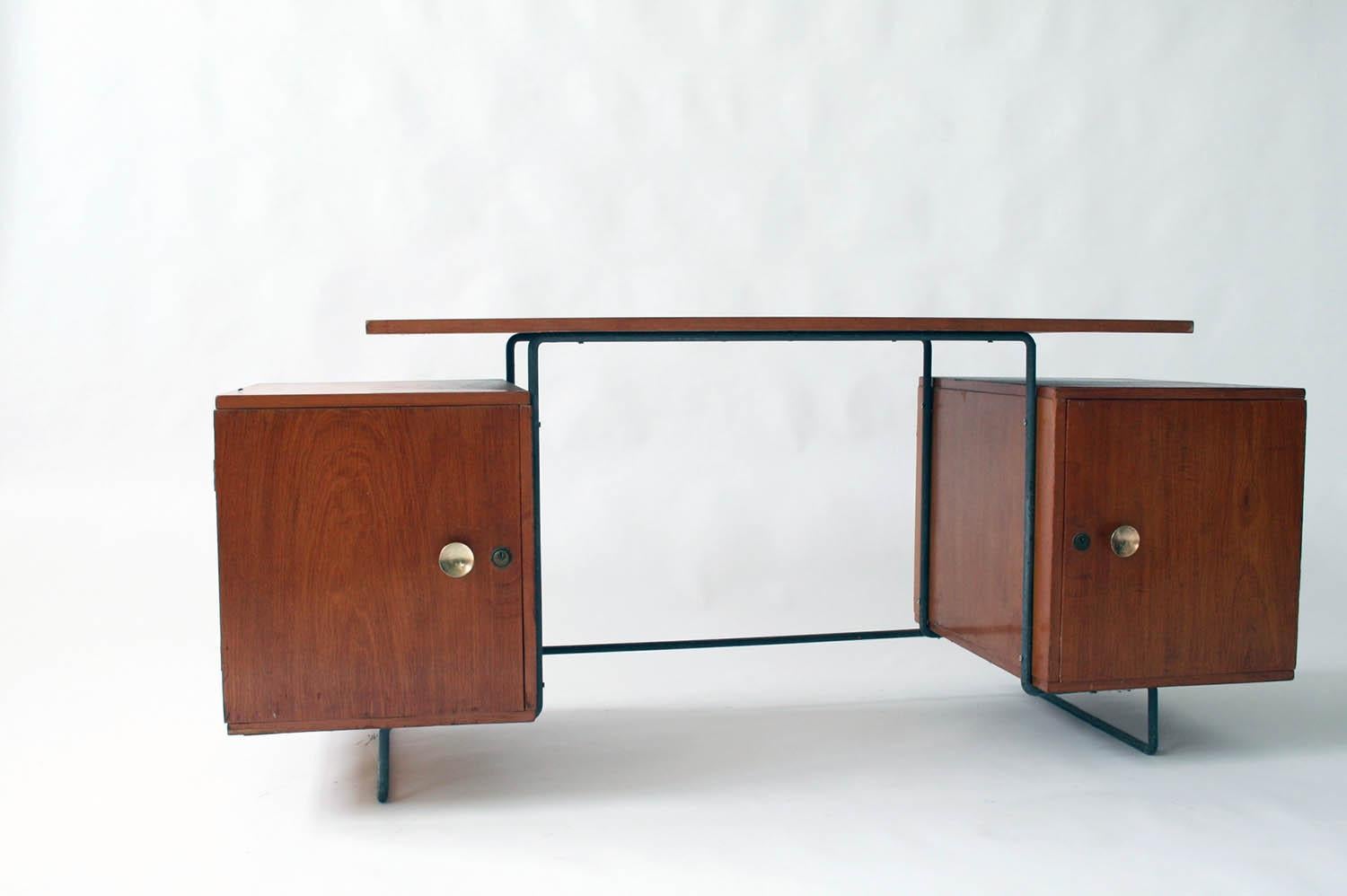 Joaquin Tenreiro iron and jacaranda floating top desk designed in 1954. Original label on underside.