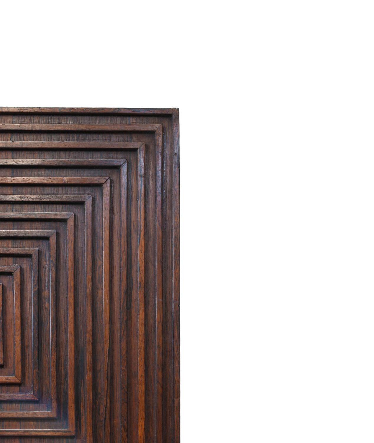 Joaquim Tenreiro, Brazil, c. 1967. Geometric wall-mount sculpture produced in a solid rosewood and designed using a traditional framework known as “Muxarabi” technique including a particular diamond wood cut in the center.
Measurements
W 23.5'' x D