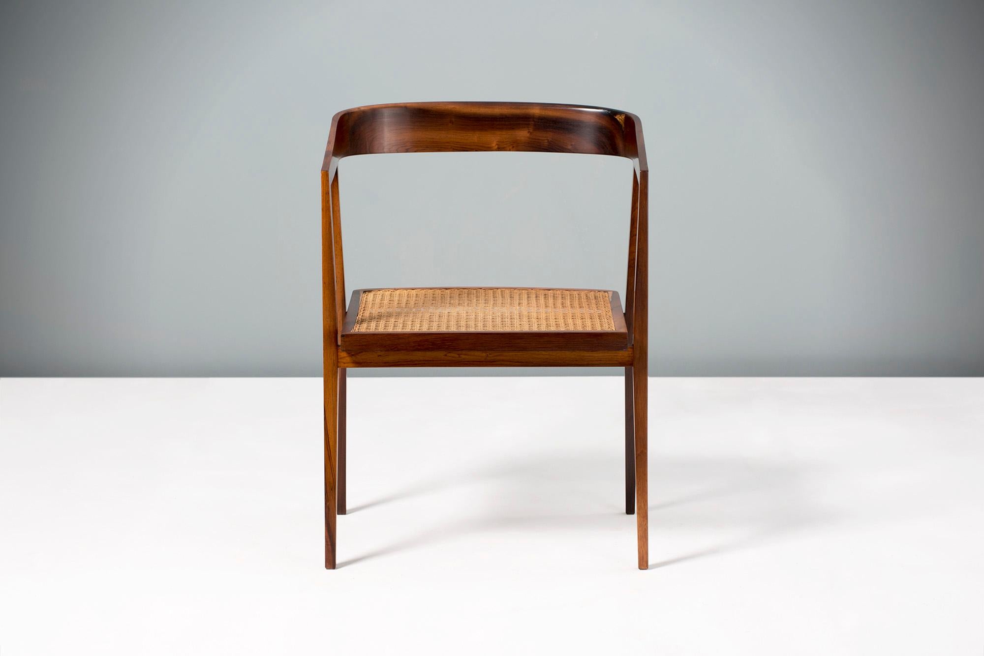 Joaquim Tenreiro 

(Brazilian, 1906-1992) 

Armchair produced in Pau Ferro wood (Santos Rosewood) and cane in the 1960s.

One of Tenreiro's most collectible and sought after chairs. This example is in immaculate condition with no breaks or