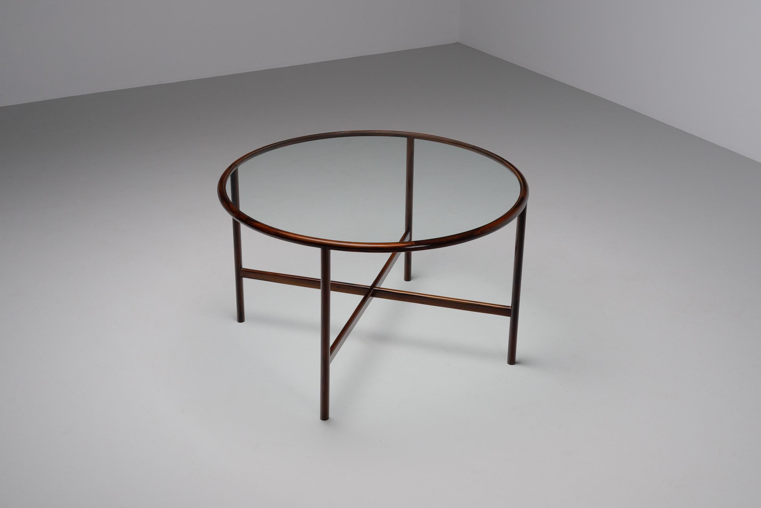 Beautiful and super rare round dining table by Joaquim Tenreiro, Brazil 1960. The precision and attention to detail by Tenreiro are visible in every inch of this creation. Each curve and joint speak of his masterful understanding of the medium,