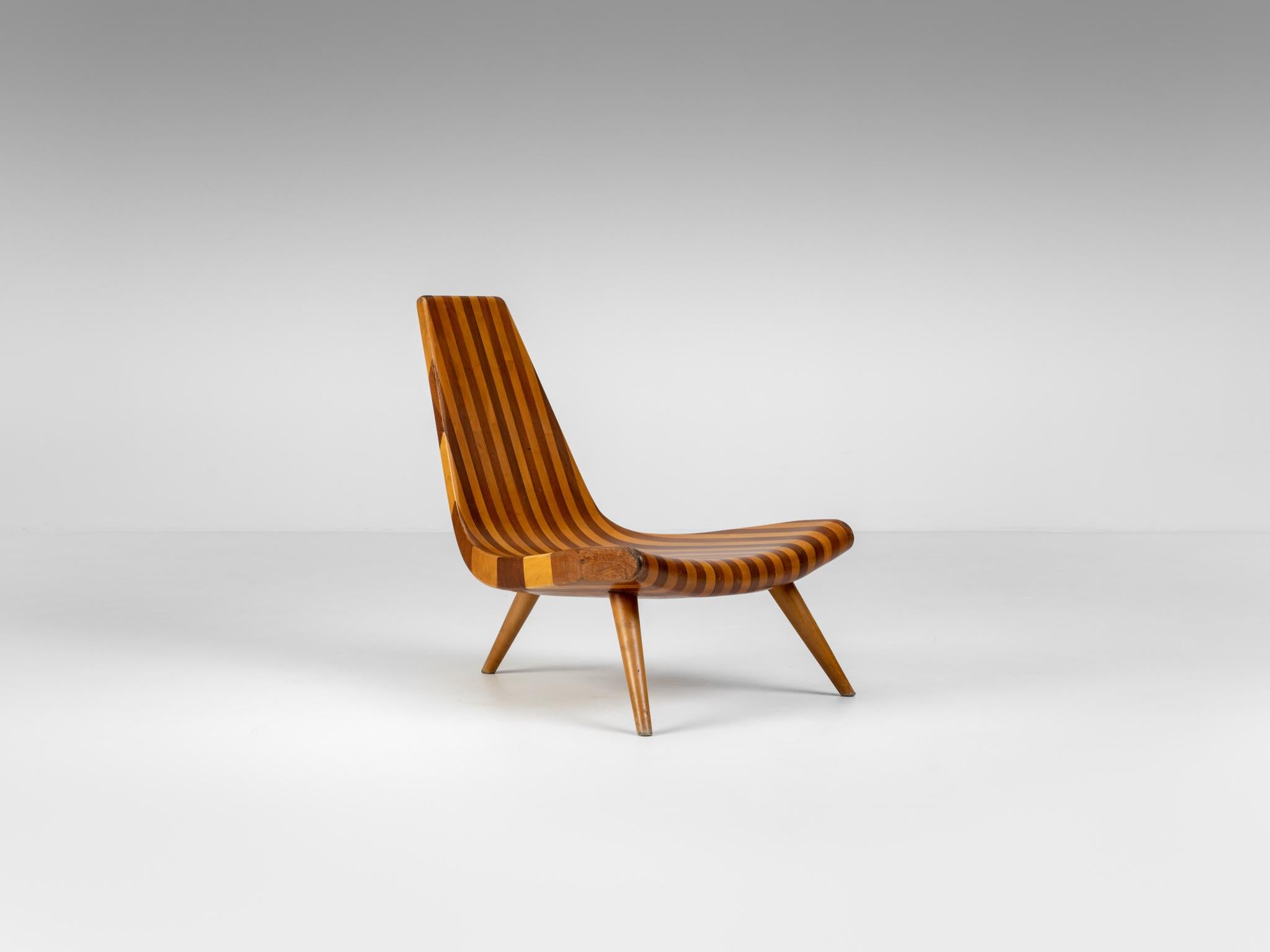 The Three-legged Chair (Cadeira três pés) is one of the most recognizable designs by Joaquim Tenreiro and the symbol of the high quality of his craftsmanship. Tenreiro’s great knowledge of the nature of wood and its technical possibilities allowed