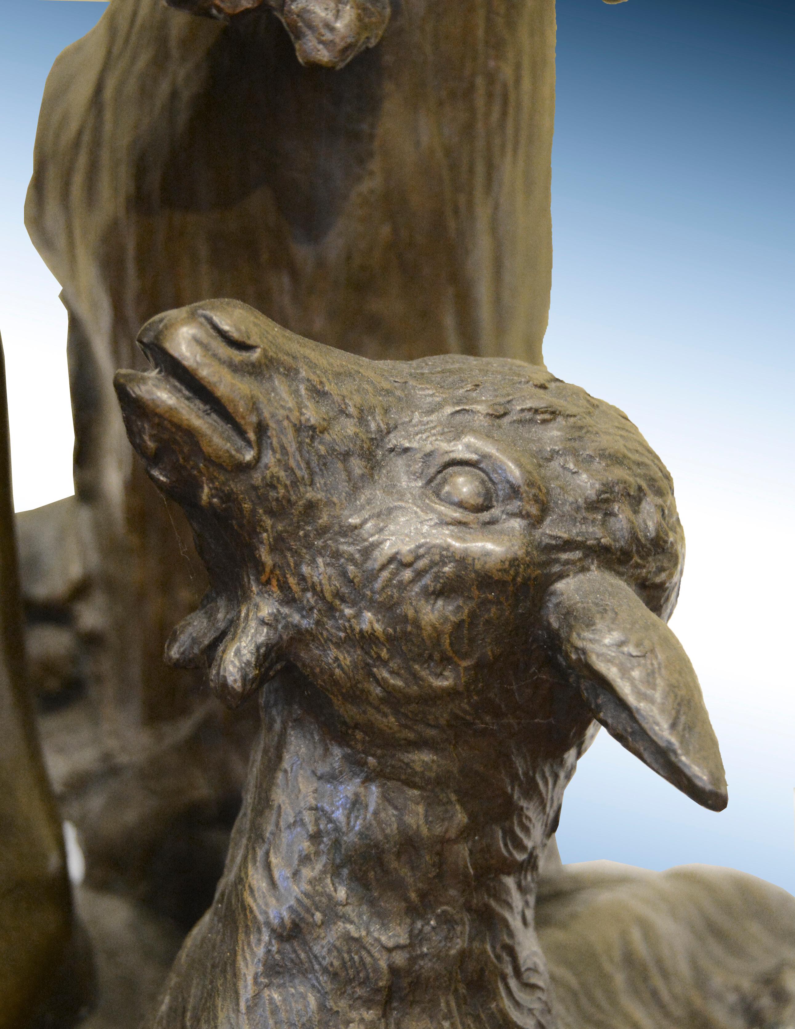 Bronze Sculpture of a young boy playing a lute with a lamb by his side 