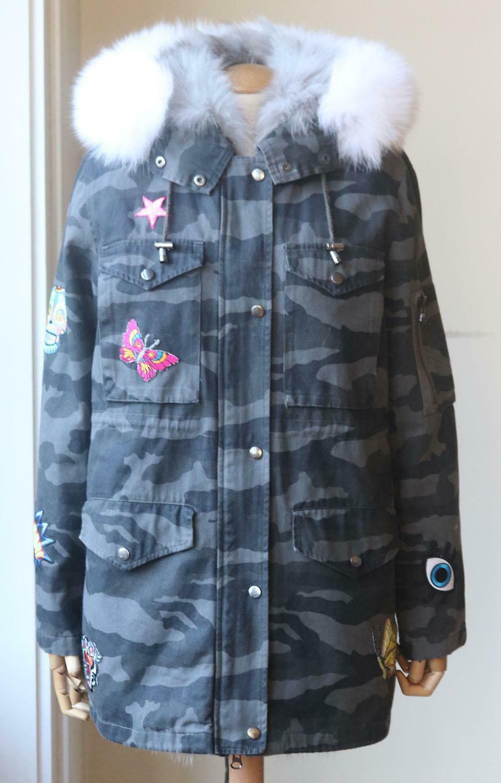 This cotton-canvas parka by Jocelyn is patterned with a tonal-grey camouflage print and lined in grey fox-fur for added insulation, it has also been adorned with multicoloured embroidered butterflies throughout. Tonal-grey cotton-canvas, grey and