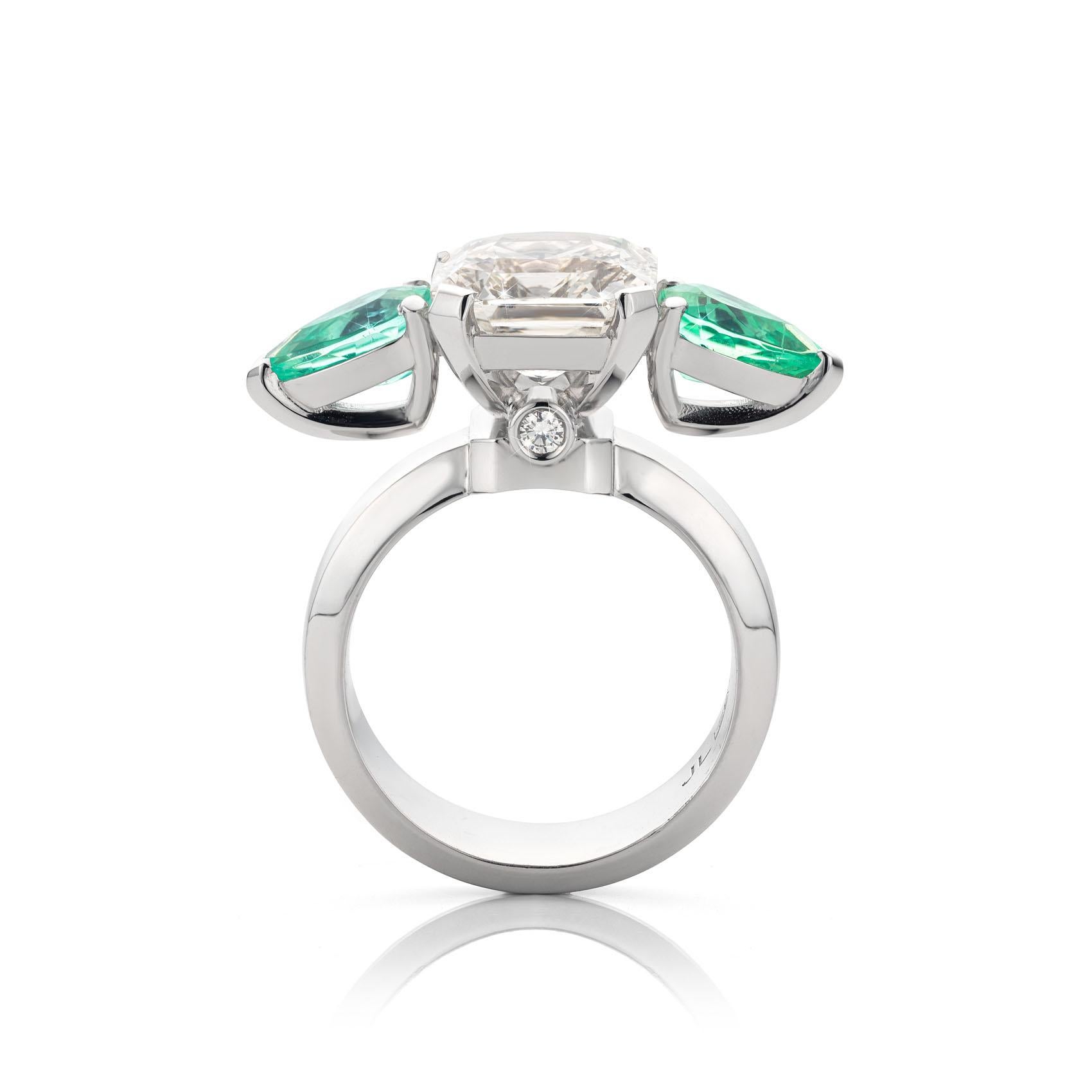 Platinum 950 Cocktail Ring featuring a 2.24 Carat White Sapphire and 2,24 Carat Paraiba Tourmaline stones.

Radiant cut measuring 11.5 x 10mm & the Pear cuts measuring 5,74 x 8,5mm.
The White Sapphire Ring is set with Collection Grade Diamonds