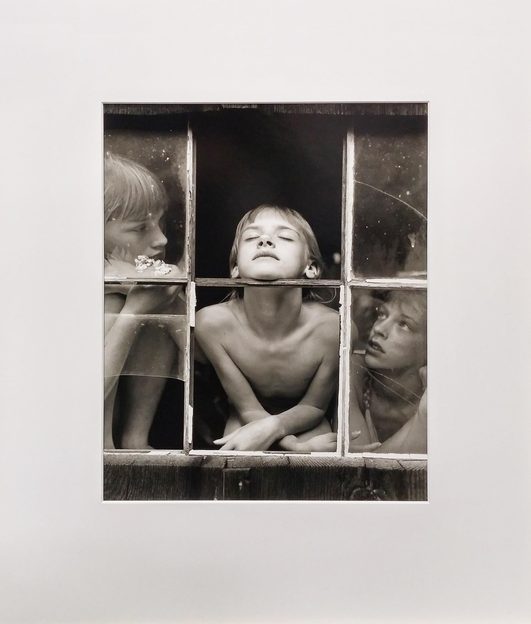 Published by Aperture in 1992, this portfolio includes three gelatin-silver prints and a cover page all in a cloth-covered clamshell case. Each of the 3 prints are hand signed, dated, titled and numbered on verso. The prints are 1. Christina, Misty