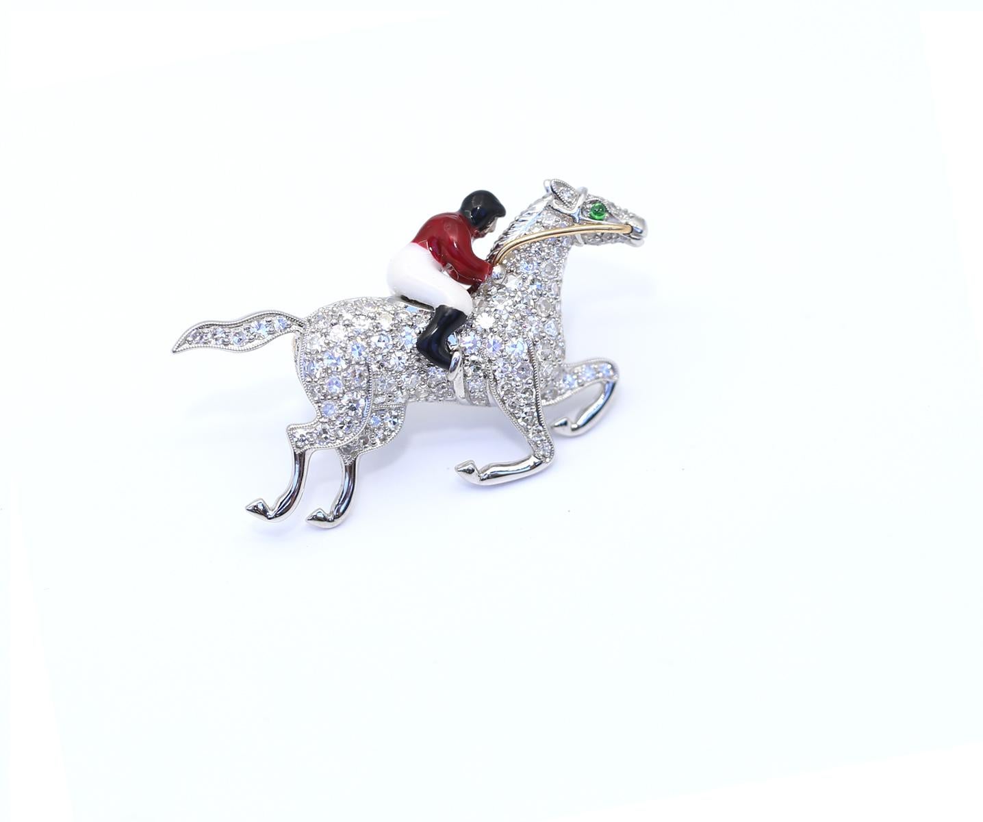 Horse Racer Diamonds Platinum Enamel Unisex Brooch. Created around 1975.
Stylish platinum brooch set with old cut diamonds with a total weight of about 1.50 Carats, the jockey on the horse coated with colored enamel, fine level goldsmith work. The