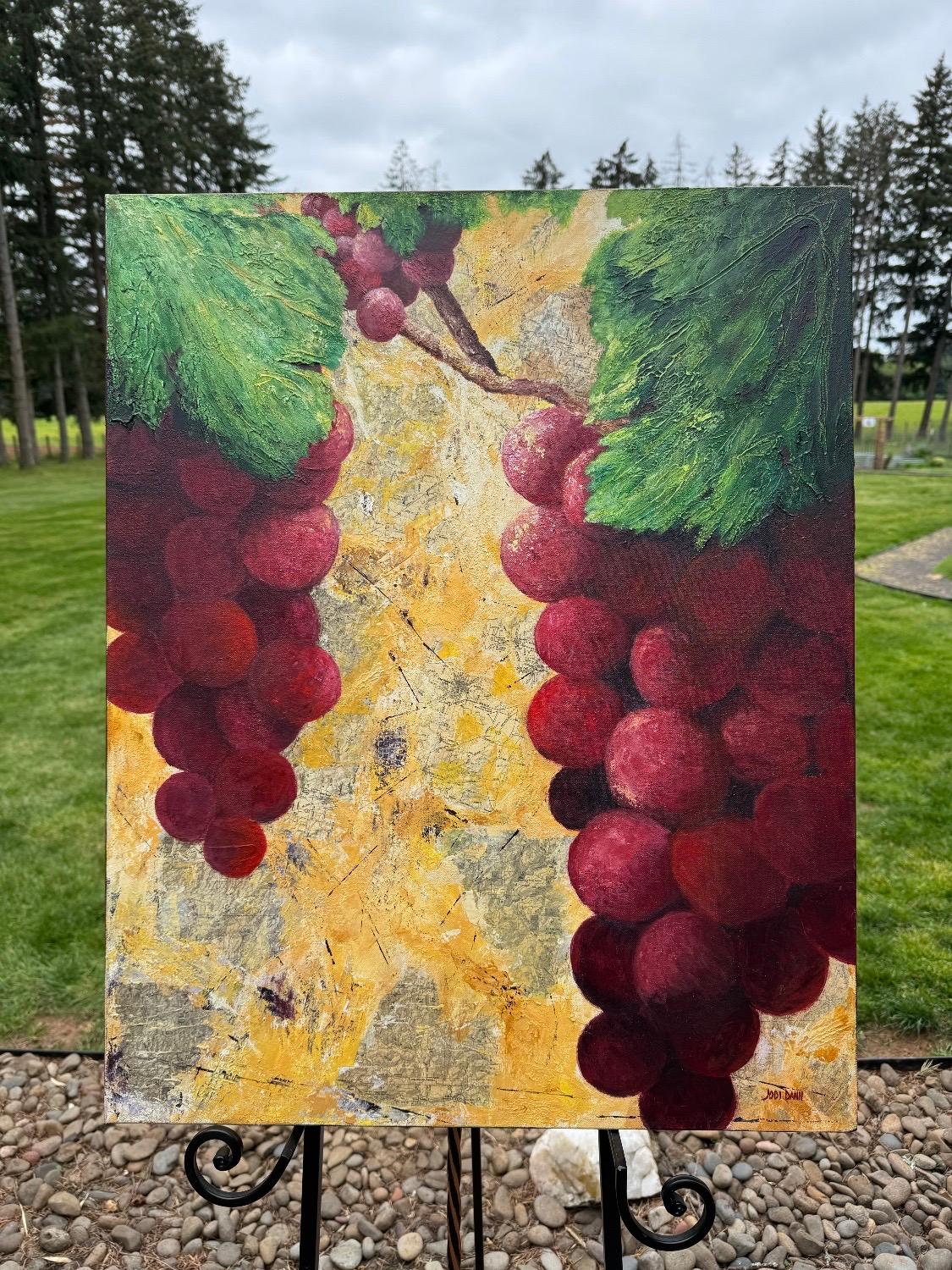 <p>Commentaires de l'artiste<br>Des grappes de raisin juteuses pendent d'une vigne, leurs couleurs profondes se détachant sur l'arrière-plan plus clair. Inspirée par une visite de vignobles, l'artiste Jodi Dann a collé des cartes et du papier de