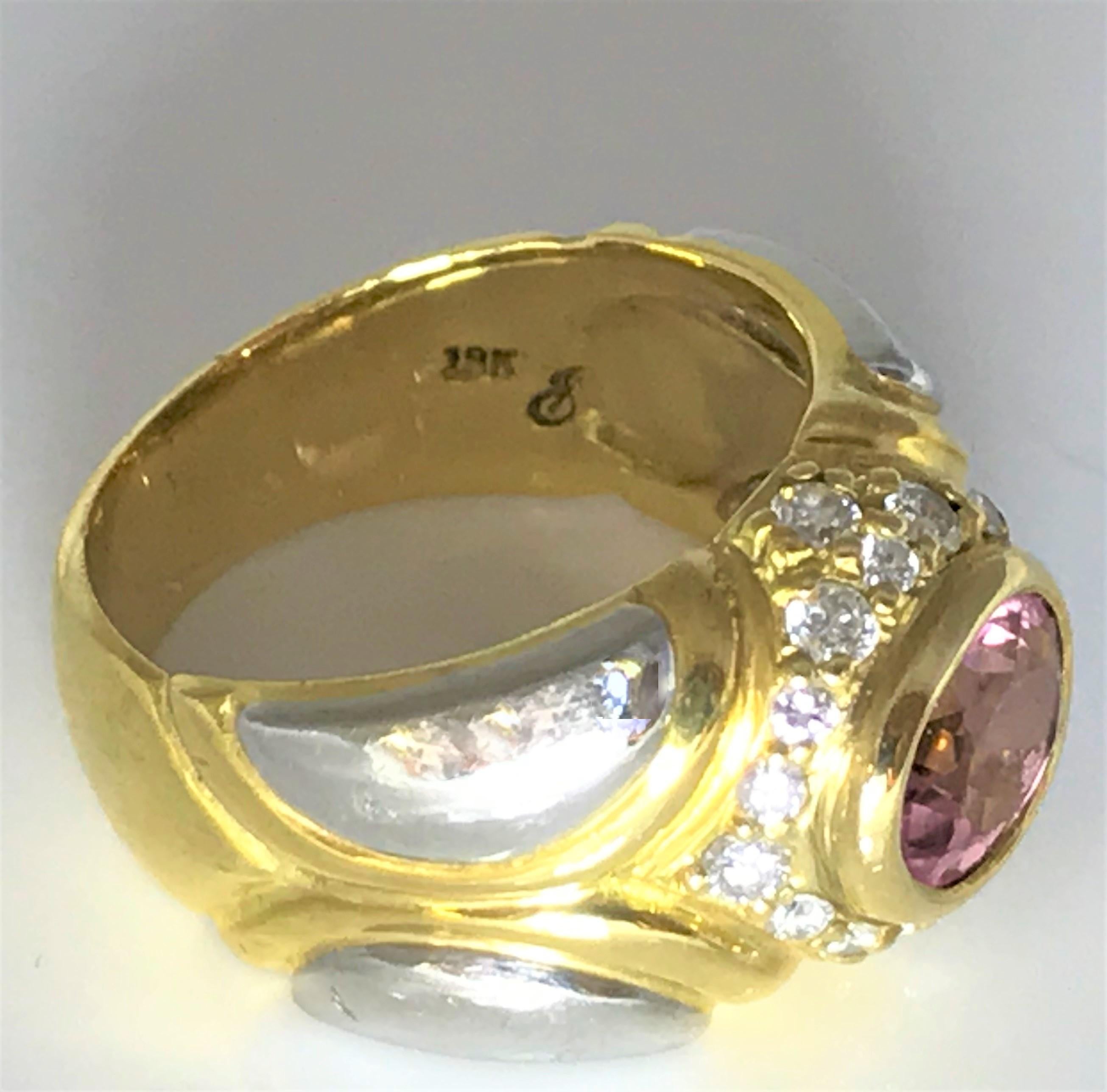Jody Serago Designer
This beautiful ring will look great on any hand!
18 karat yellow gold and platinum setting 
18 round diamonds, approximately .40tdw
Bezel set oval pink tourmaline approximately 7.5mm x 9.5mm x 4mm
Stamped 
