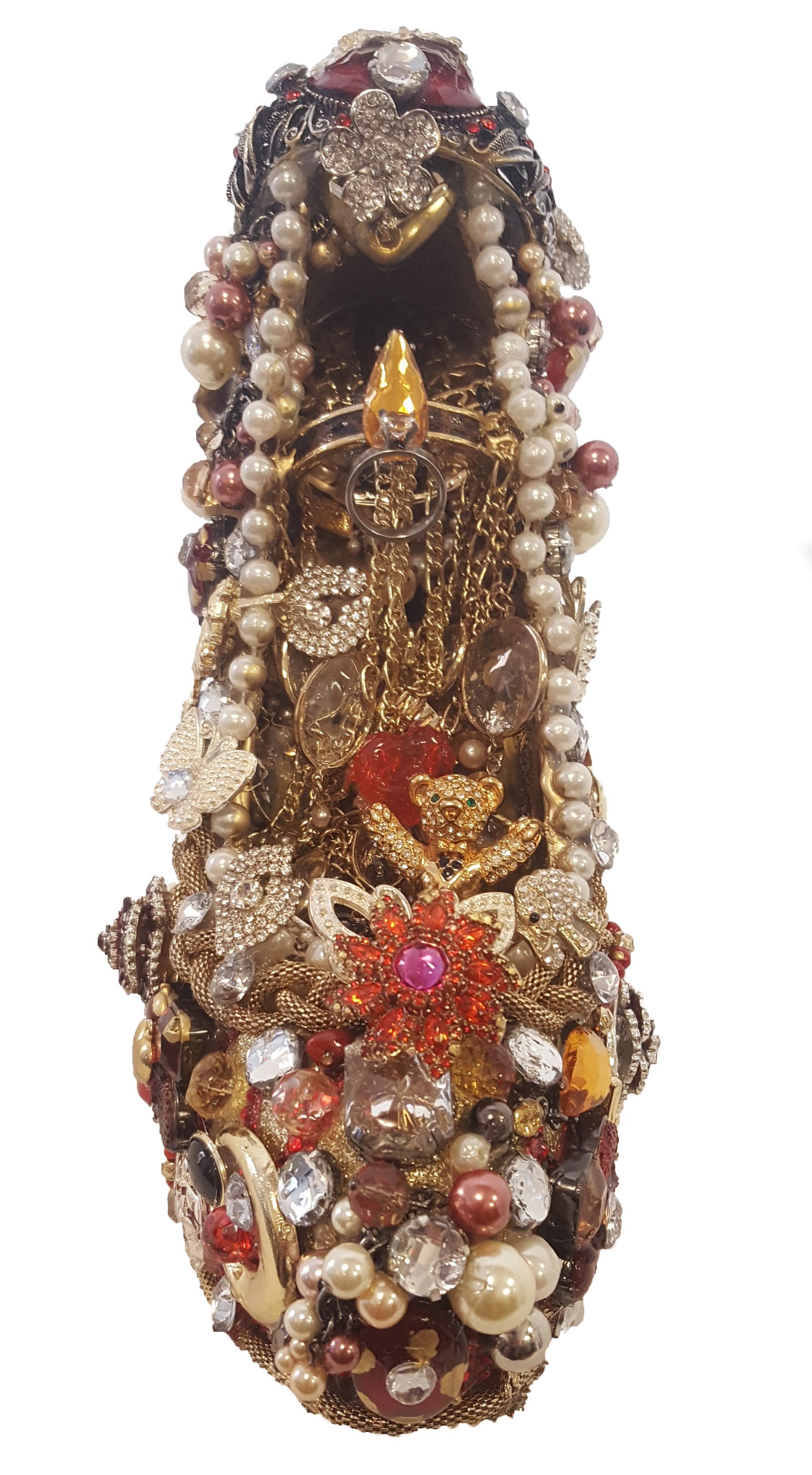 Joseph S. Mendozza AKA JoeBaby is an artist whose passion for mosaic art began 20 years ago.  His present day creations are recycled and repurposed musical instruments and fashion objets d'arts which are decorated with costume jewelry, mix media and