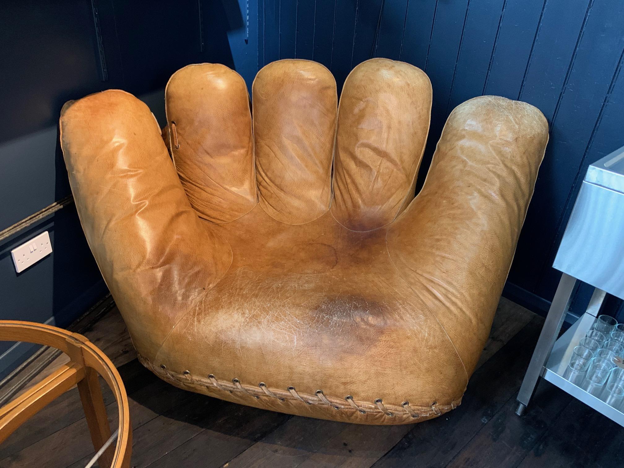 Fab, Iconic Joe DiMaggio Baseball Glove armchair, 1970s, named after the legendary Baseball star. This chair shows signs of wear and tear consistent with age and has a vintage 'patina'. There is a water tain on the seat as detailed in photos but no