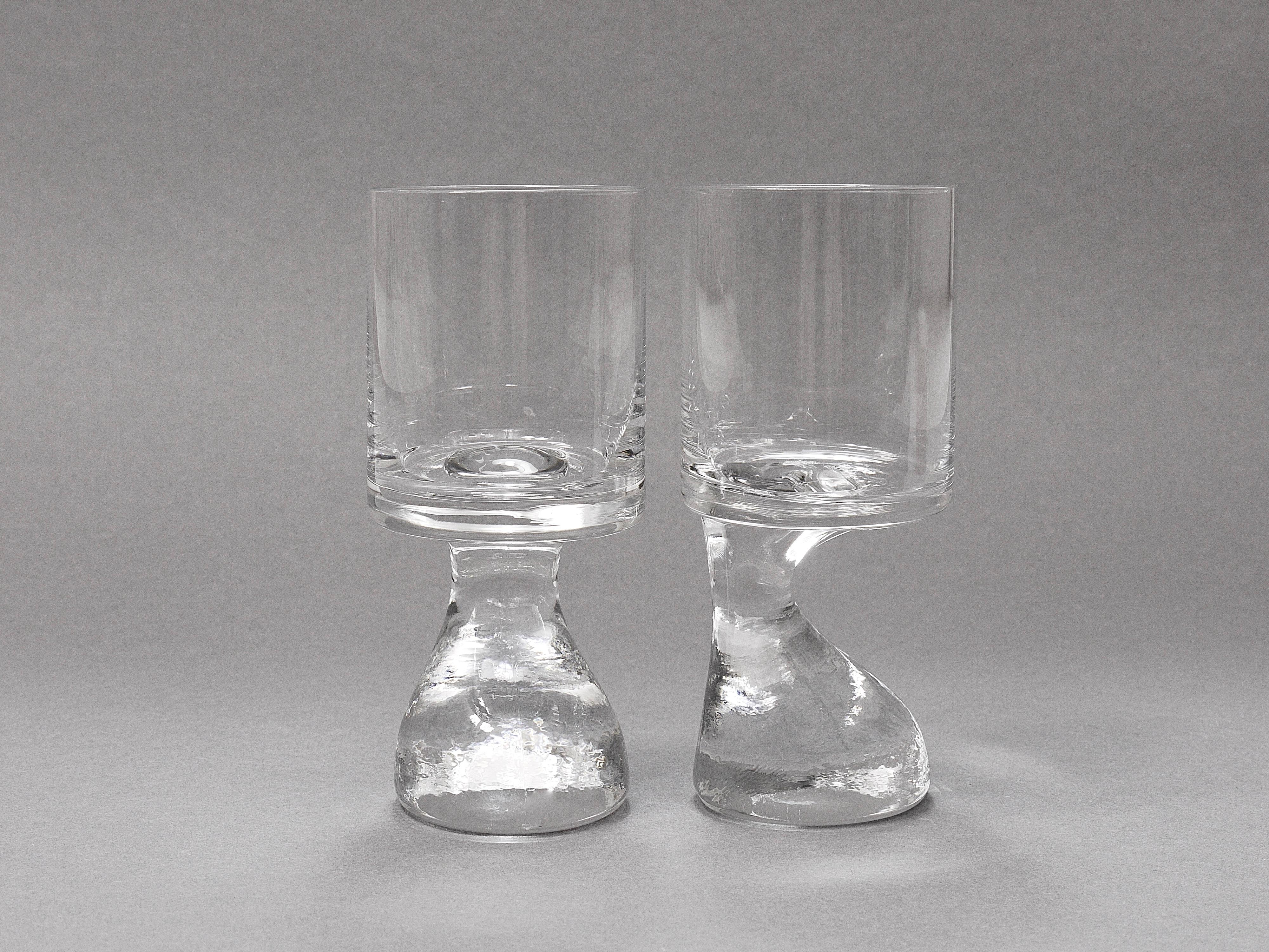 Two beautiful and fine sculptural midcentury drinking glasses, small size, to be used for liqueur or spirits. Designedby Joe Colombo in 1964 to hold the glass and a cigarette with the same hand. Made of handblown lead crystal glass by Claus Joseph