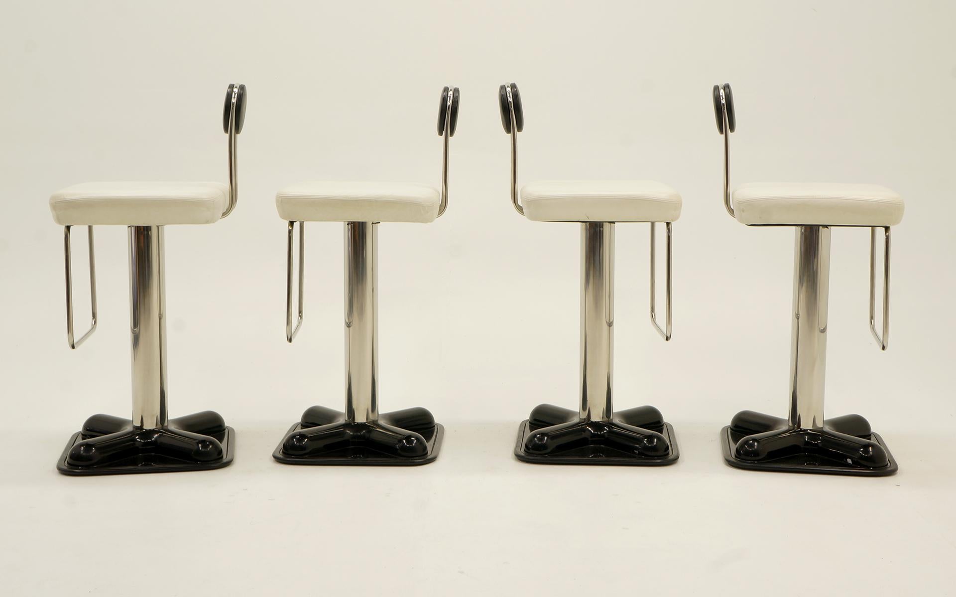 Set of four Joe Colombo Birillo barstools. Black and white leather chromed steel support and heavy duty plastic base. Memory swivel so it returns to the same position. Very good to excellent original condition. No tears or scratches to the leather.