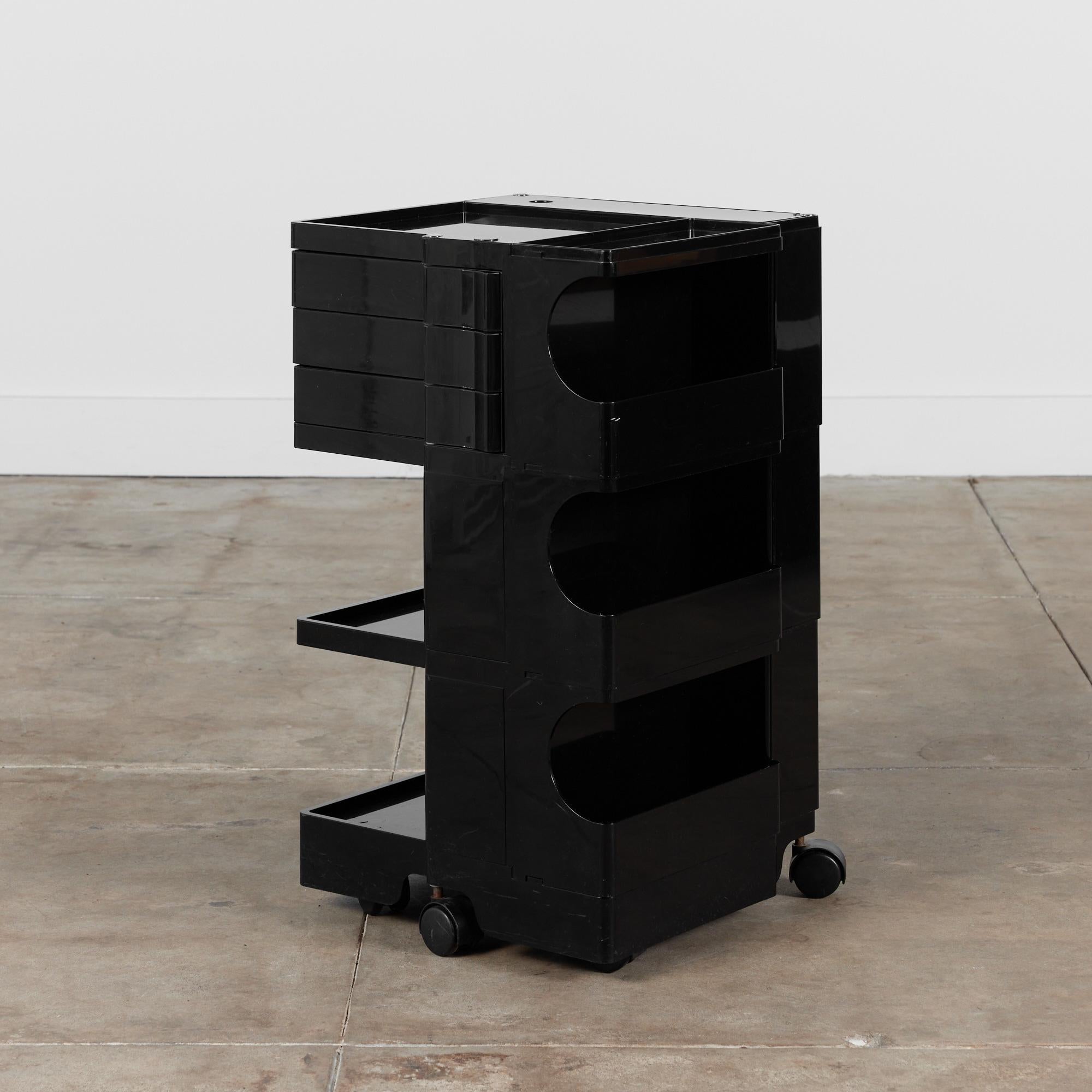 Trolley cart by Joe Colombo c.1970s, Italy. This unique plastic cart has three shallow swivel drawers and two shelves. The opposite side of the cart has three open drawers for storage. The top of this piece is divided into two shallow sections, one