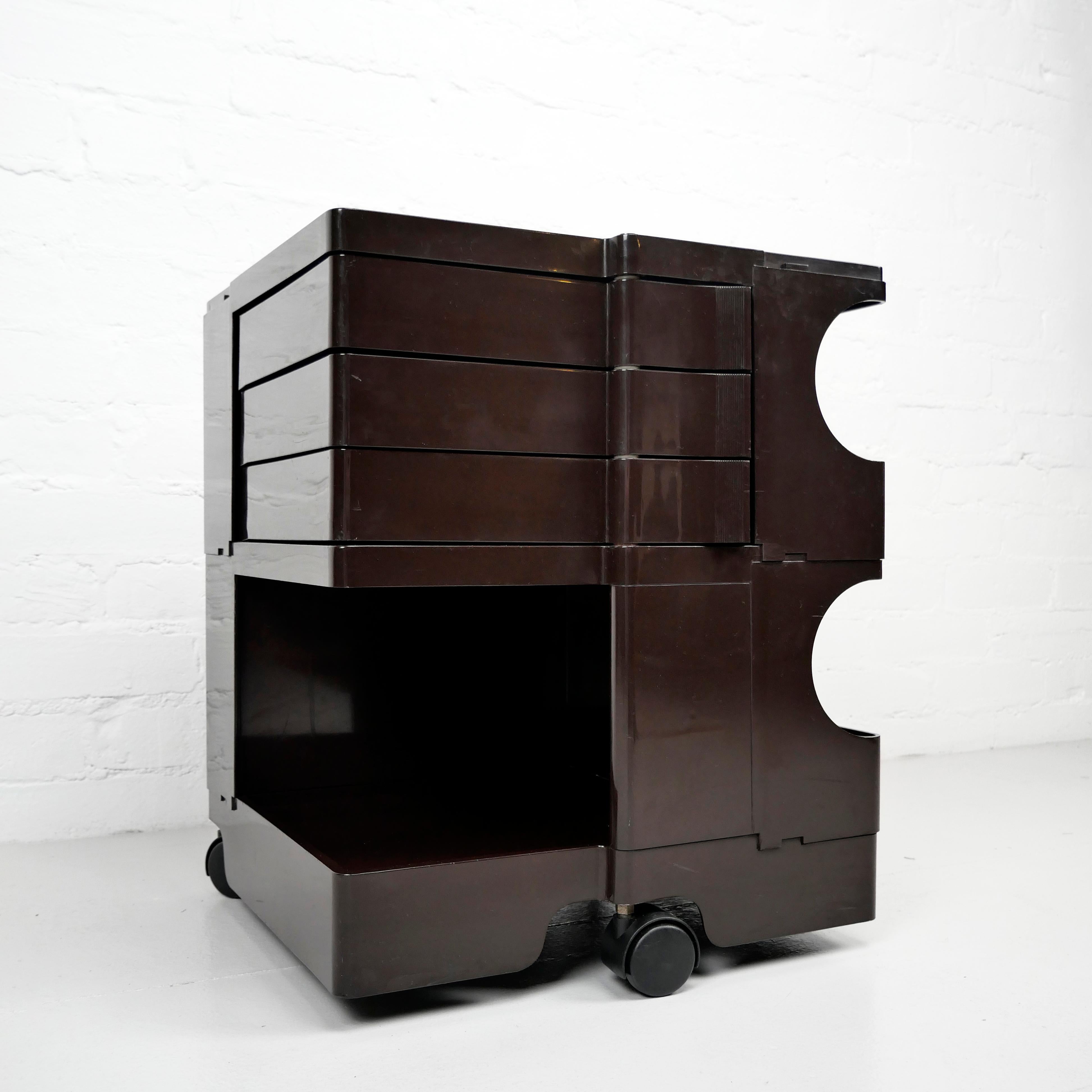 JOE COLOMBO (Italian 1930-1971)
‘Boby’ trolley

Designed 1970, this is from the original production by Bieffe (Bieffeplast), Italy
Dark brown plastic, black castors, 3 swivel drawers and removable lid for drawing roll storage

W 42 cm, D 43 cm, H 53