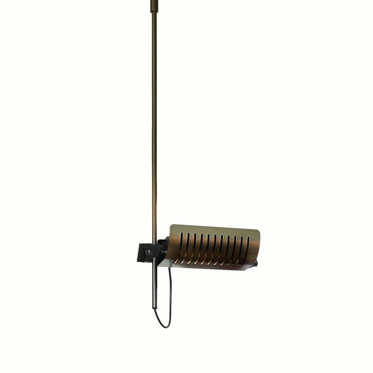 Suspension lamp 'Colombo' designed by Joe Colombo in 1970.
Ceiling lamp giving direct and indirect light, chromium-plated stem, lacquered ceiling fixing. Adjustable reflector in lacquered aluminium. Manufactured by Oluce, Italy.

The visionary