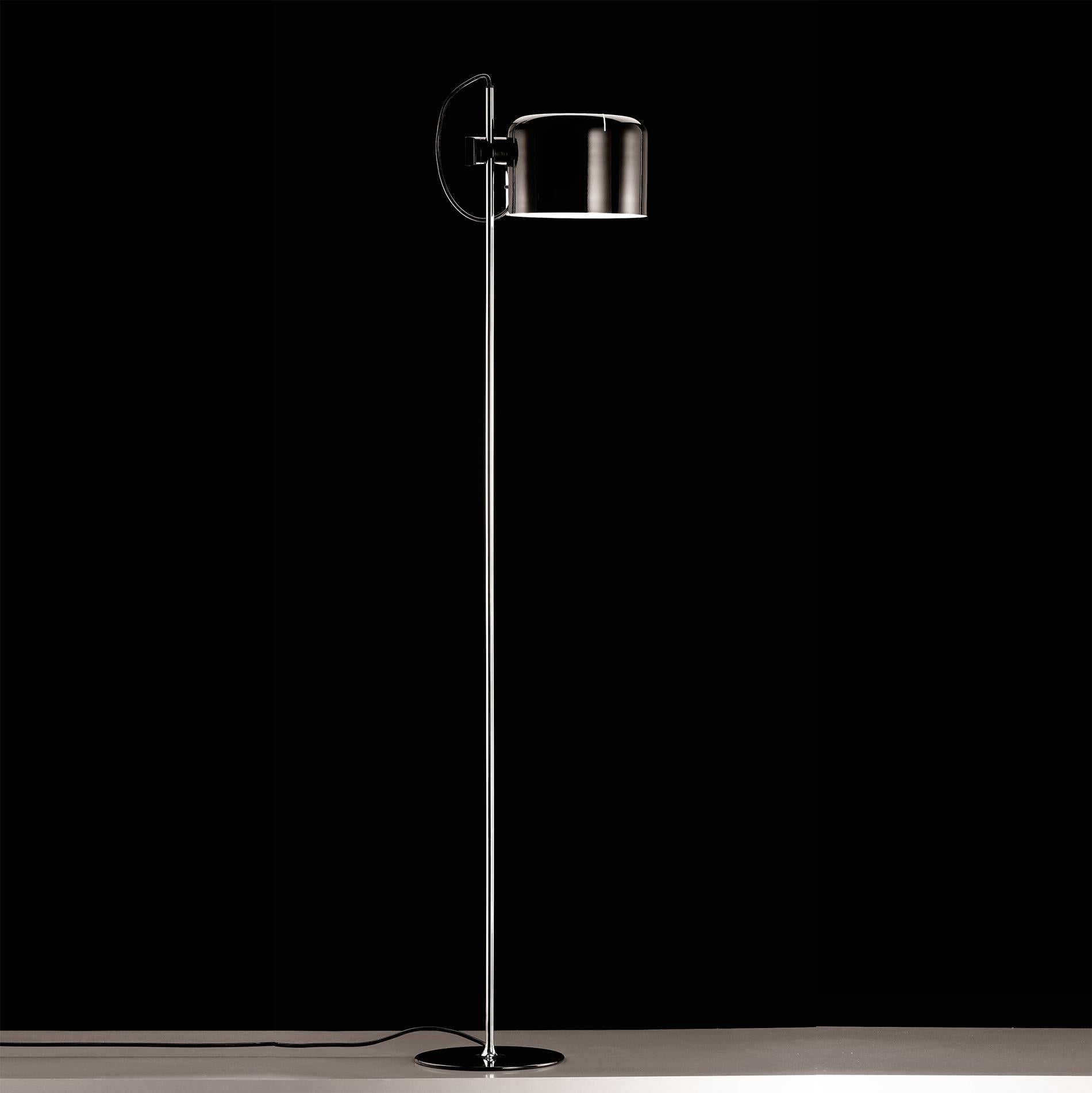 Floor lamp 'Coupé' designed by Joe Colombo in 1967.
Floor lamp giving direct light, lacquered metal base, chromium-plated stem, adjustable reflector in lacquered aluminium. Manufactured by Oluce, Italy.

The Coupé series, designed by Joe Colombo,