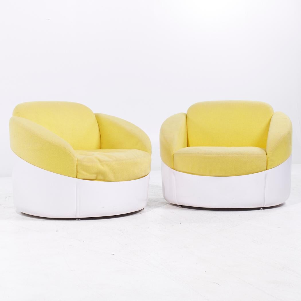 Joe Colombo for Stendig Mid Century Fiberglass Lounge Chairs - Pair

Each lounge chair measures: 32 wide x 32 deep x 26.5 high, with a seat height of 14 and arm height/chair clearance 20 inches

All pieces of furniture can be had in what we call