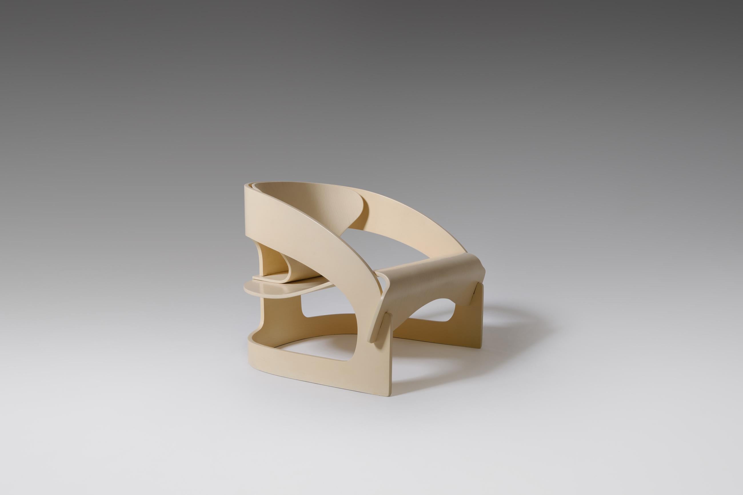 Rare early '4801' plywood armchair by Joe Colombo for Kartell, Italy, 1965. Stunning innovative design composed of three interlocking curved plywood elements; like a folded sculpture. The idea of Colombo was to design a lounge chair that could