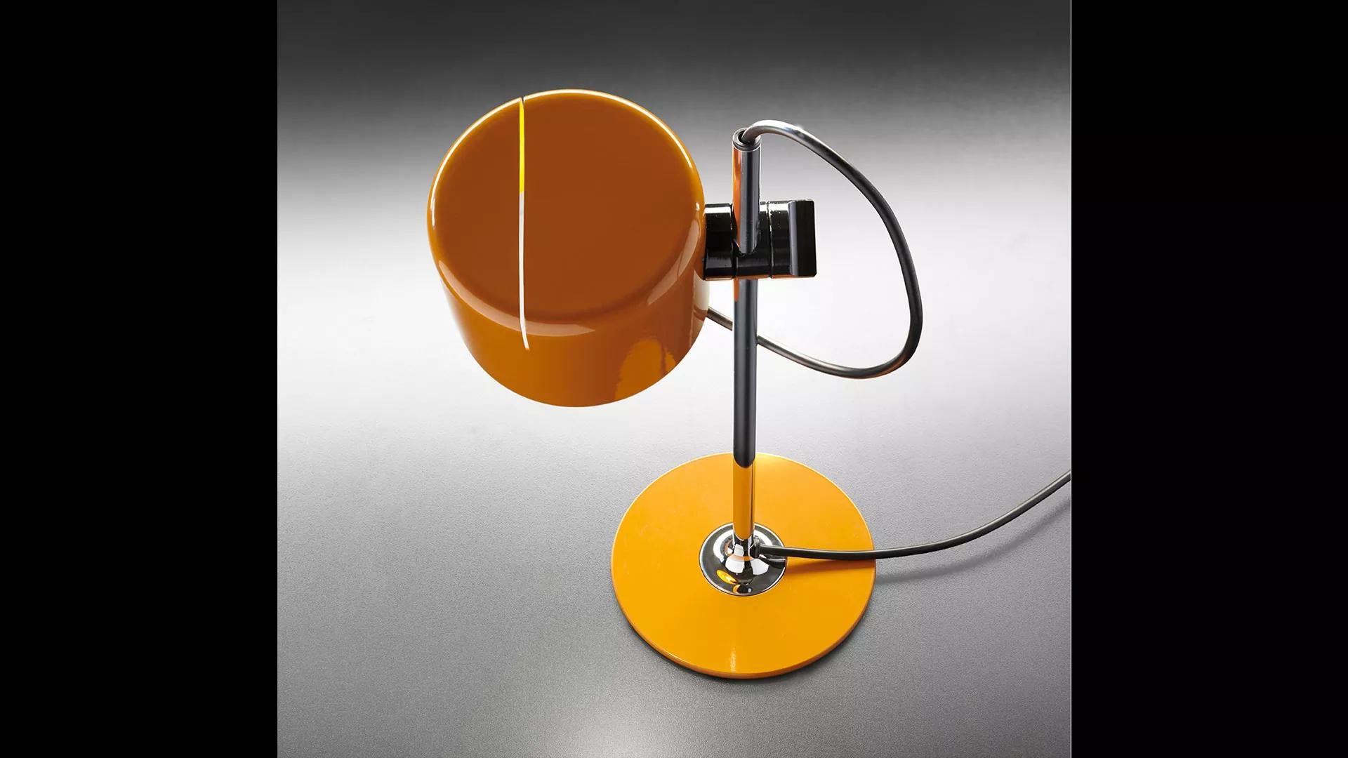 Joe Colombo Model #2201 'Mini Coupé' table lamp in mustard yellow for Oluce. 

Executed in yellow enameled metal and chrome, this table lamp is a smaller-scale version of one of the most refined Minimalist Italian designs of the midcentury and an