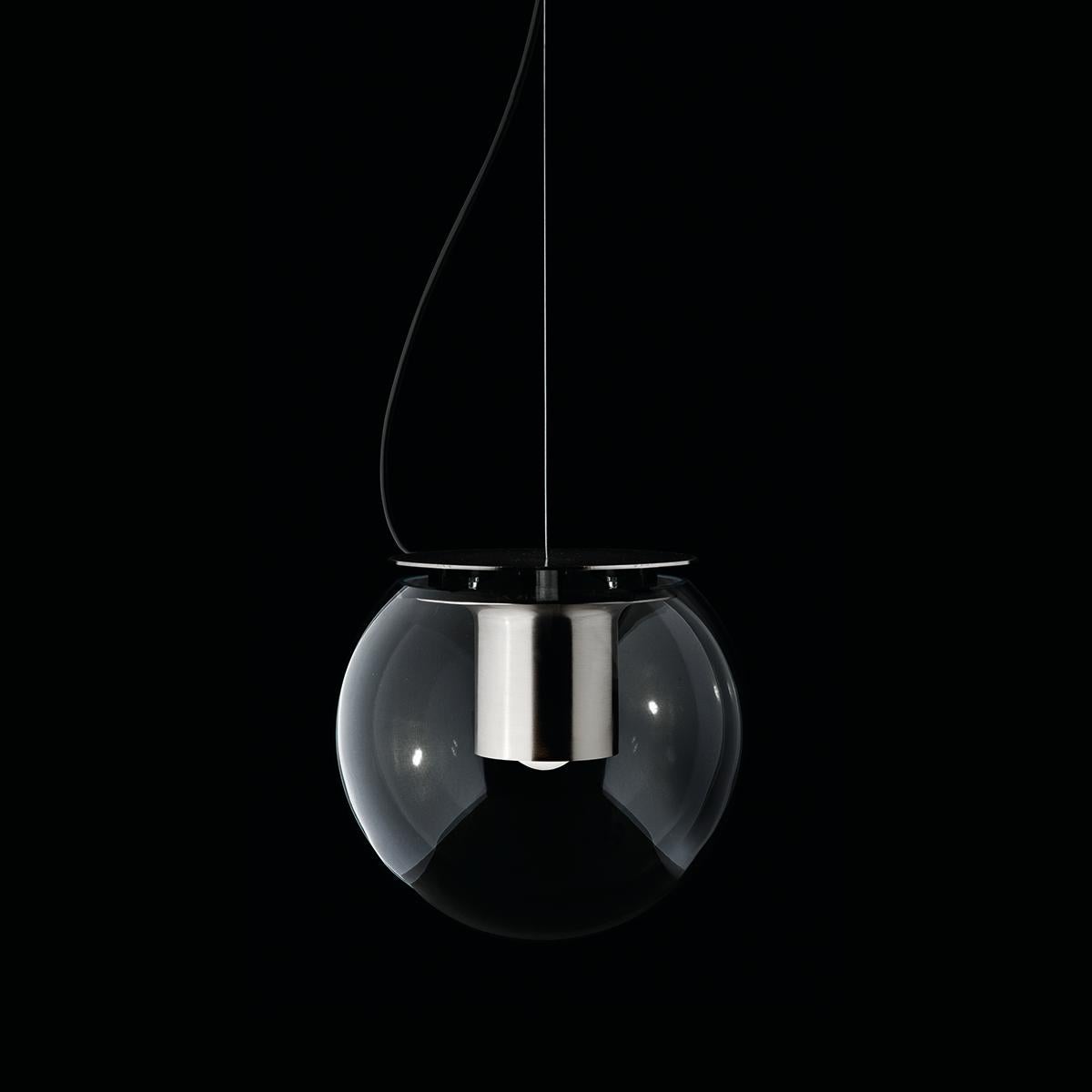 Suspension lamp 'The Globe' designed by Joe Colombo in 1964.
Suspension lamp giving direct and diffused light in transparent blown glass. Manufactured by Oluce, Italy.

The Globe is a lamp which was designed by Joe Colombo in 1964, created in table,
