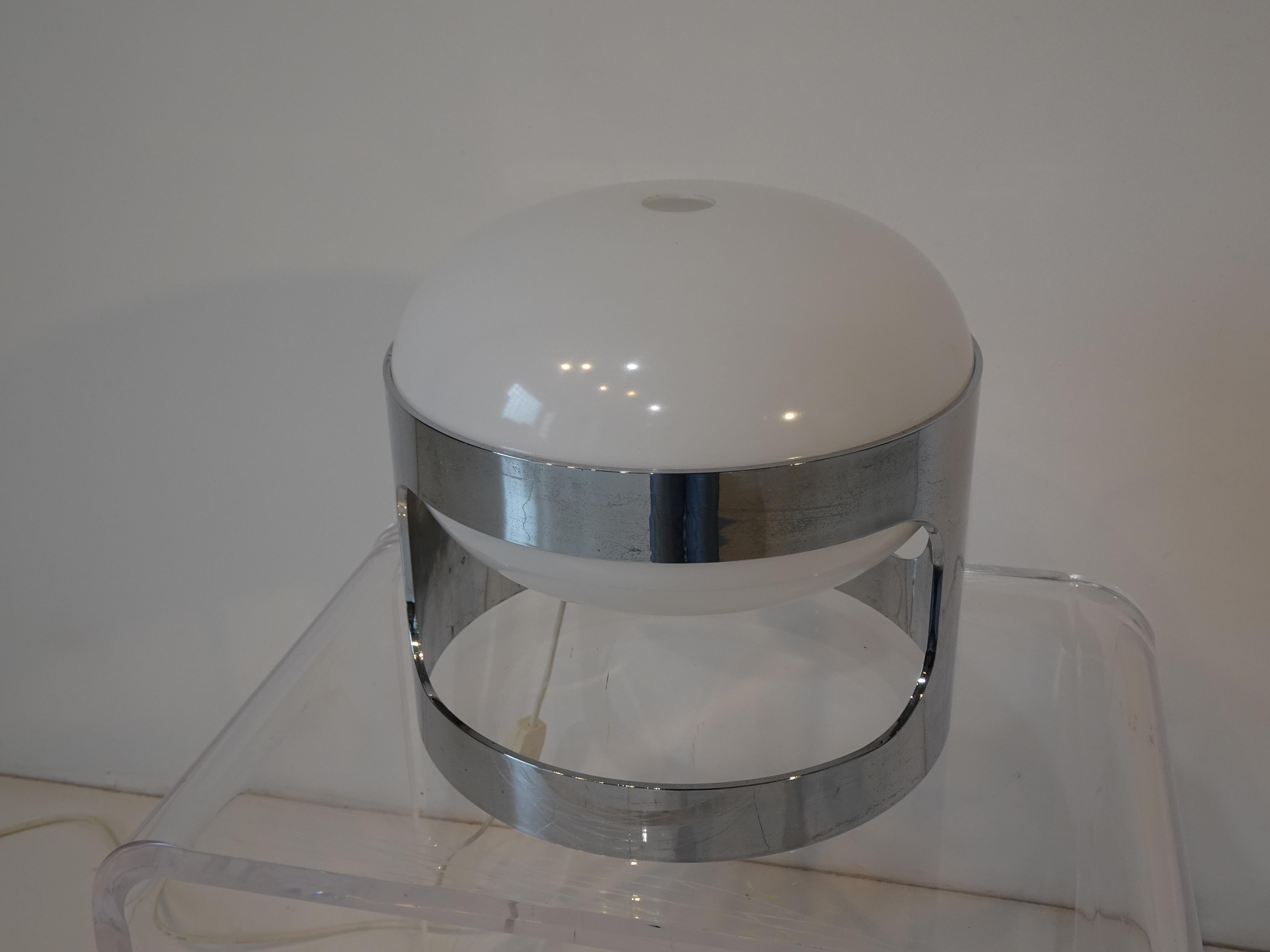 A vintage plastic formed table lamp with chromed holder, split domed shade and in line switch by designer Joe Colombo. Produced by Kartell in the 1970's the KD 27 was one of Colombo's most accessible lamps for the public but being constructed in