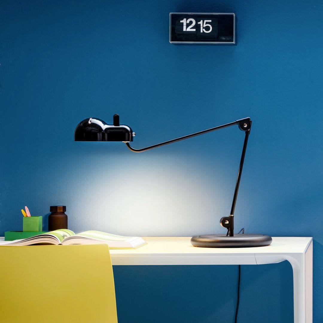 Joe Colombo 'Topo' table lamp in black with base for Stilnovo

Founded in 1946 in Milan, Stilnovo was one of the most innovative lighting companies in Italy during the Midcentury era, producing iconic pieces by such luminaries as Joe Colombo,