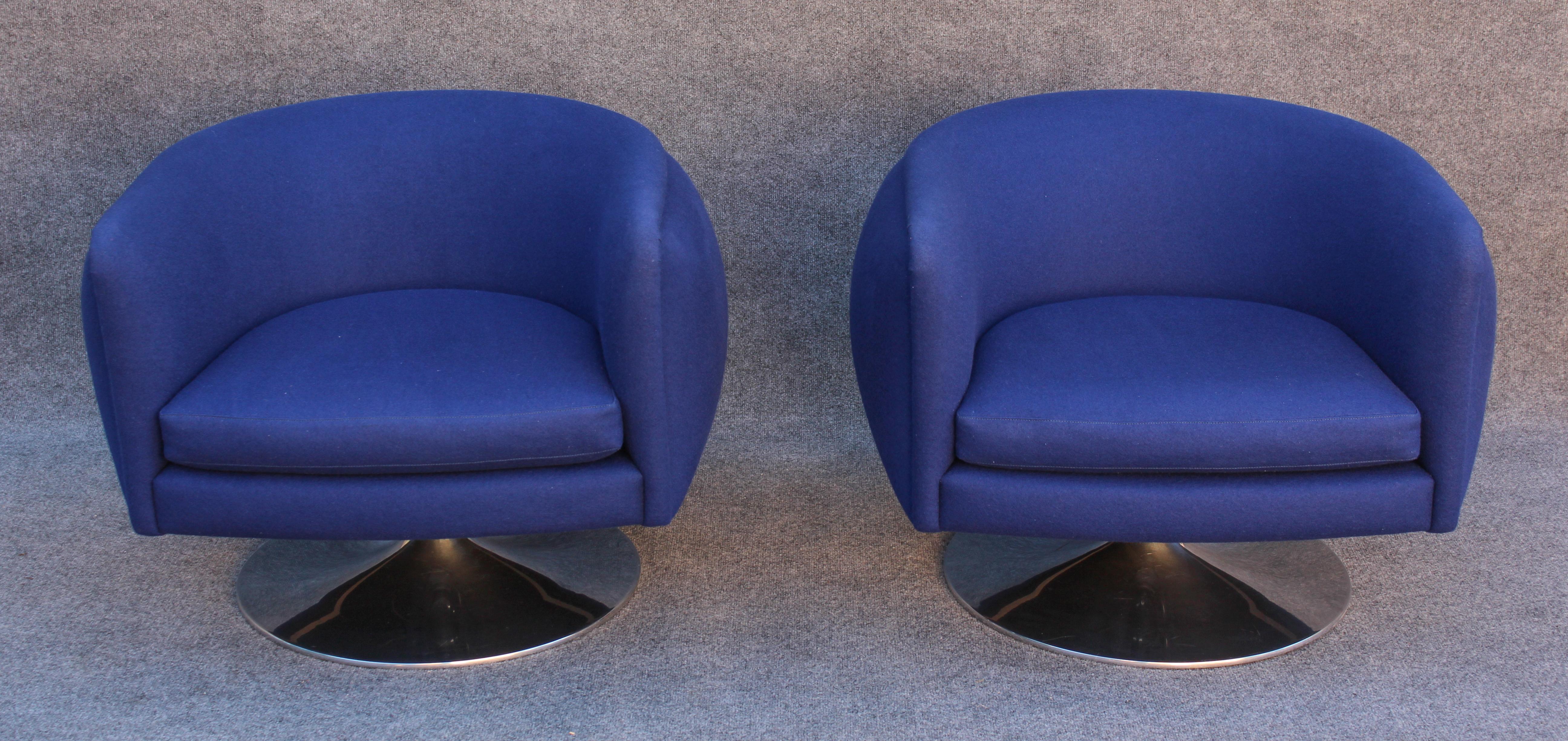 One of Joe D'Urso's most iconic designs, this pair of chairs was produced in  by Knoll. This pair forgoes the 'return to center' feature in favor of the more practical height adjustment, which is operated with a lever beneath the seat. This also