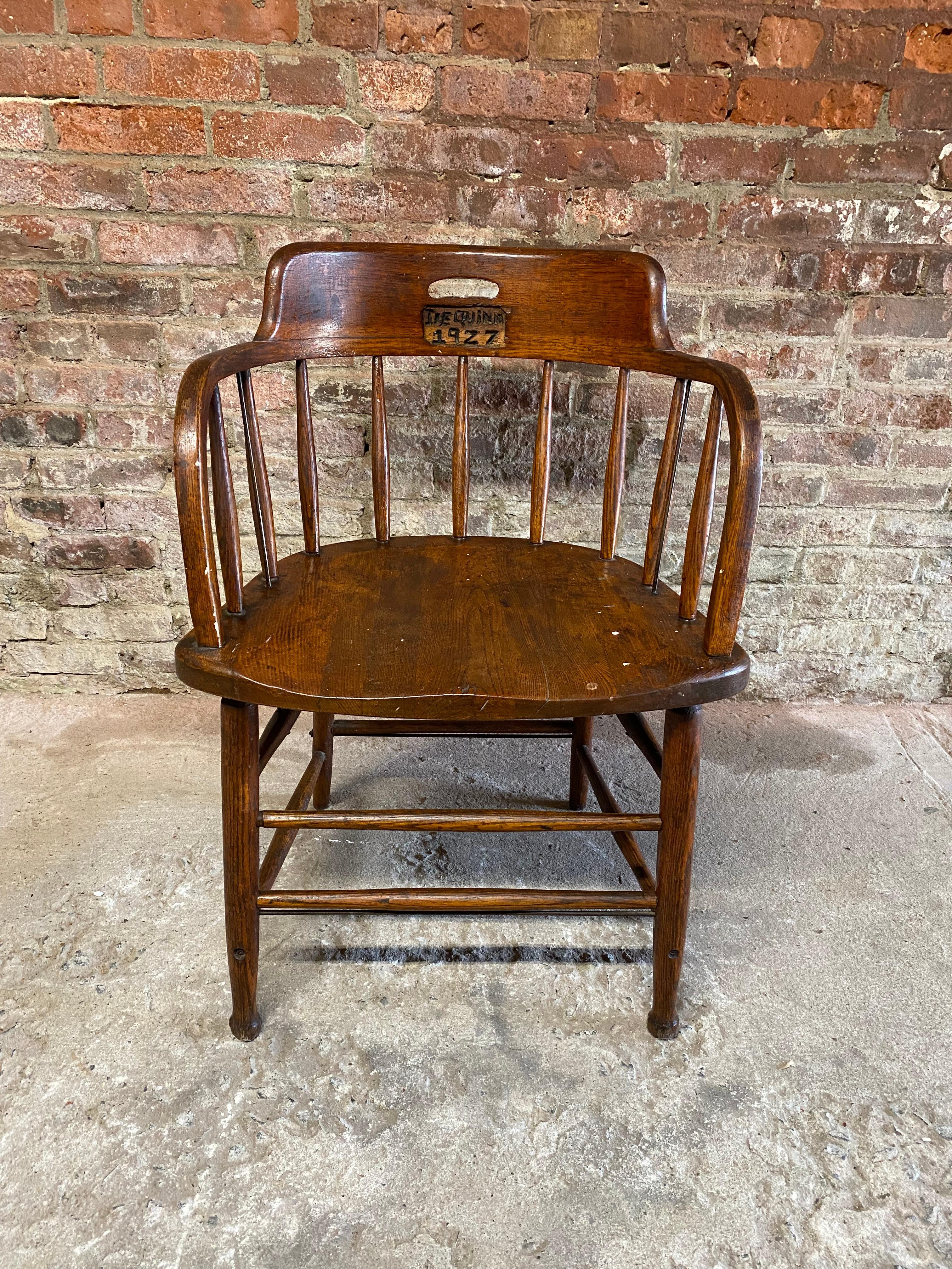 This is not your typical solid oak spindle back oak captain's chair, but one that has been hand carved by a previous owner. Did Joe Quinn carve the back of this chair in 1927 or did someone else carve it and gift it to Joe Quinn? You decide. The