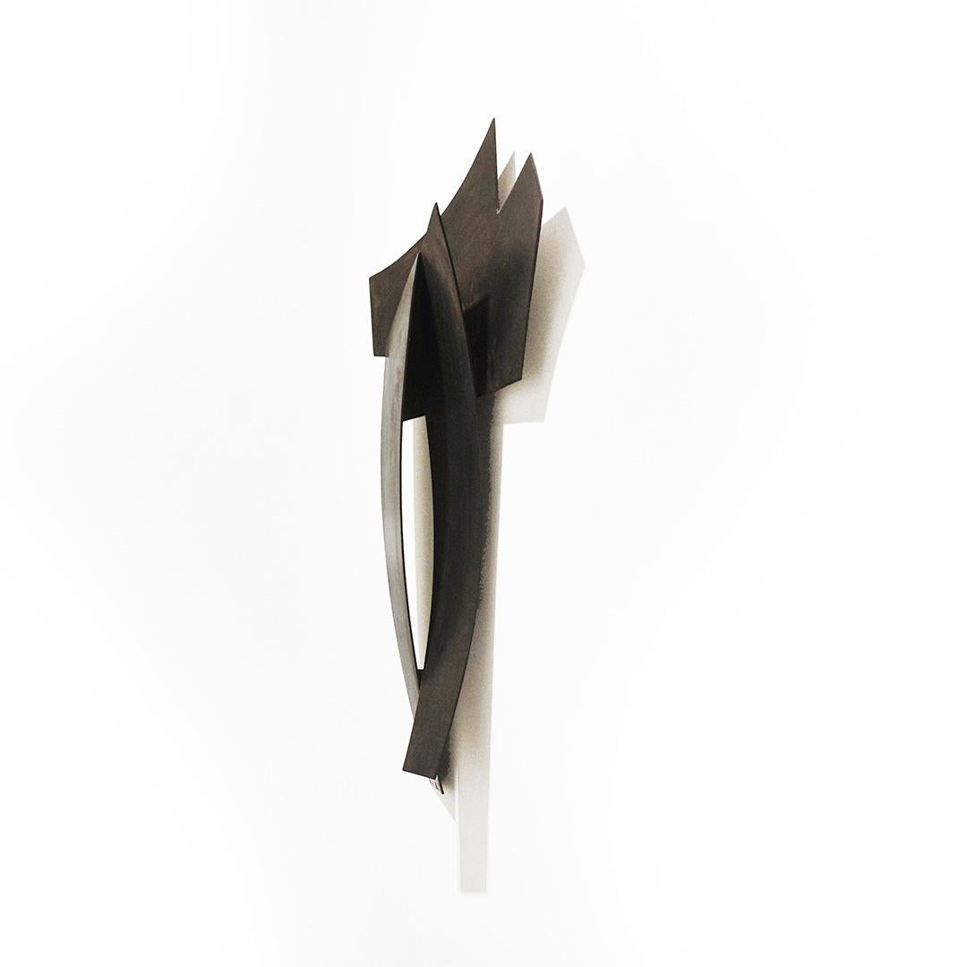 Minimalist, abstract geometric wall sculpture in dark oxidized metal 
We Were Never Strangers, made by Joe Wheaton in 2019 
30 x 19 x 3.5 inches, oxidized stainless steel 
Hangs on a French cleat 
Lightweight, weighs about 5 lbs. 
Signed, verso